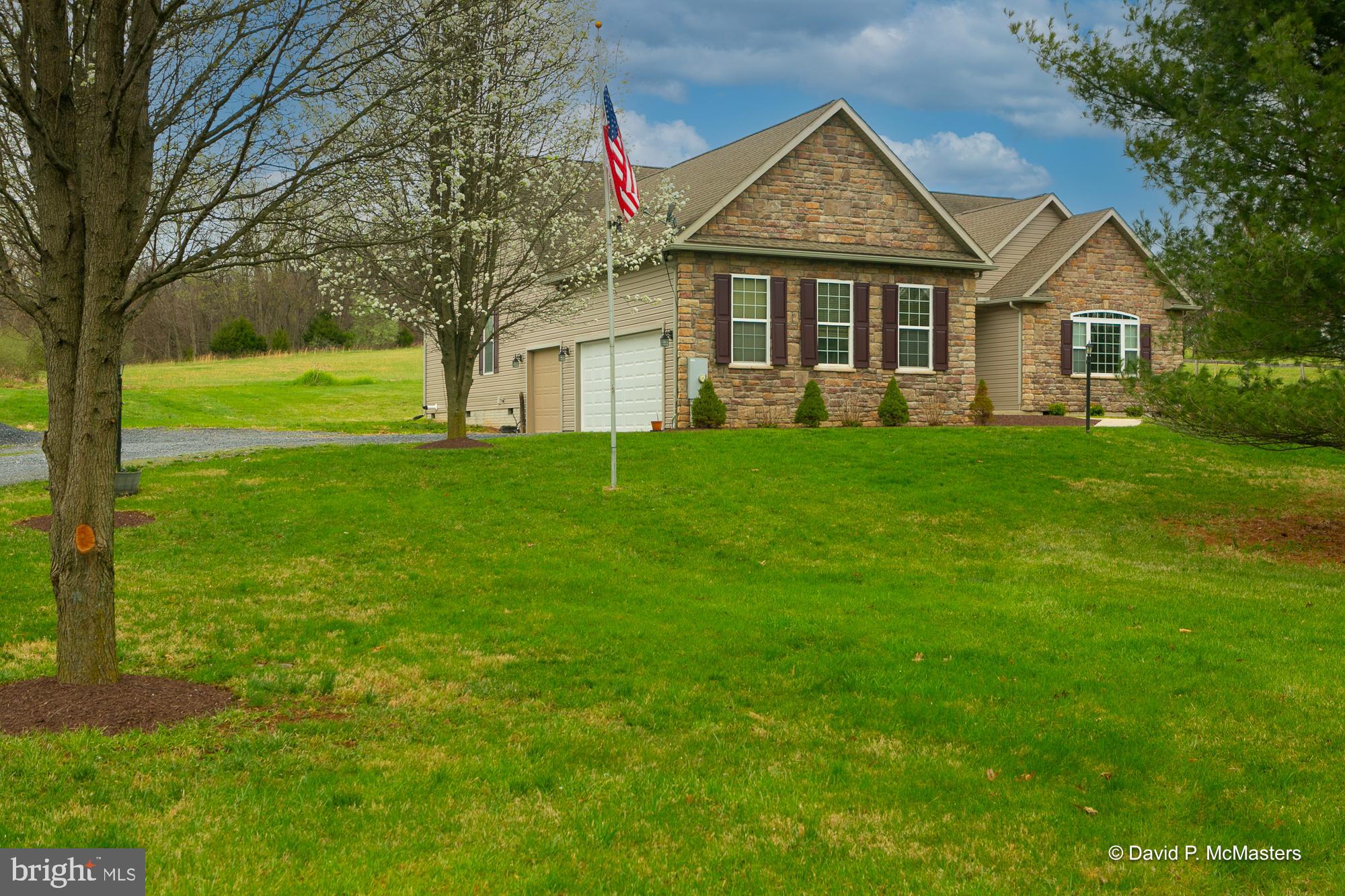 Amazing opportunity.  Great location.  Custom built 2400 SF wide open rancher on just over 2 acres. Hardwood floors.  New Carpet.  HUGE Rooms.  Amazing stamped concrete patio and covered concrete porch.  MASSIVE 3 car garage.