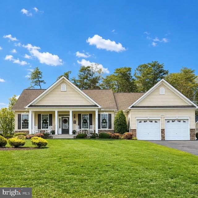 Welcome to 39815 Grandview Haven Drive in Mechanicsville — a beautifully maintained rambler offering nearly 4,900 finished square feet of living space on a private 0.88-acre lot backing to trees. This 4-bedroom, 3.5-bath home combines spacious one-level living with an expansive finished lower level and exceptional outdoor entertaining spaces.  

The main level features an open floor plan with engineered wood flooring, 9-foot ceilings, recessed lighting, and a gourmet kitchen with stainless steel appliances, double wall oven, cooktop, upgraded countertops, pantry, and breakfast area flowing seamlessly into the family room with gas fireplace. The primary suite offers a spa-style bath with soaking tub, walk-in shower, and spacious walk-in closet. Two additional bedrooms, a full bath, powder room, and main-level laundry complete the main floor.  

The fully finished lower level adds incredible flexibility with a large recreation area, theater room, fourth bedroom, full bath, and abundant space for entertaining, guests. 

Step outside to your own private backyard retreat featuring extensive hardscaping, exterior wrought iron fencing, and a fenced in-ground concrete pool with waterfall, designed for summer enjoyment.   The oversized driveway and attached two-car garage provide ample parking and storage.  

Located in the desirable Grandview Haven community, this home offers the perfect balance of privacy, space, and convenience while showcasing the quality and thoughtful design QBHI homes are known for.