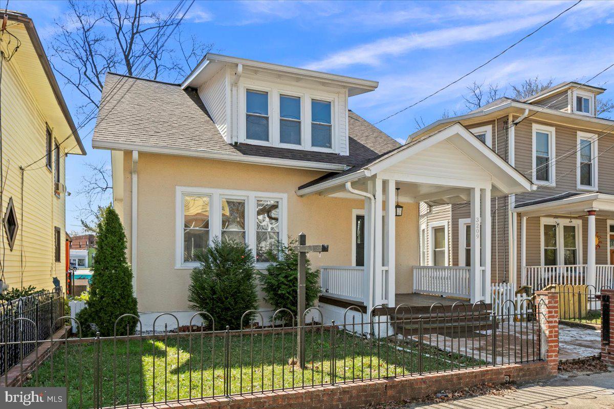If a home can be cheerful, this one is! Flooded with light, this delightful classic bungalow in the heart of Mt. Rainier is surprisingly spacious with four bedrooms above grade. 

The home is packed full of charm. As you enter, you are greeted by the gorgeous original staircase and entry area. Vibrant colors set the tone as you walk through the large living and dining areas. The kitchen is flooded with light thanks to the new french doors and deck with stairs to the fenced-in rear yard. On this level there is also a lovely and conveniently private main-level primary suite with full bath, bedroom, and additional sitting room. 
Upstairs, you'll find three spacious bedrooms and a full bath, including the option of an additional primary bedroom. Here the charm continues - both in the vibrant colors and also the original trim and cute tuck-ins featured in the bedrooms. 
The lower level of this home offers even more living space. Accessed either from the stairs to the lower level inside the home or a separate entrance on the rear of the home, the lower level features a kitchenette, living area, full bathroom and two additional rooms. On the other side of the lower level is a laundry area and mudroom.  
The yard beyond is private and serene. Filled with fruit trees and fenced-in, it offers a peaceful retreat. The detached two-car garage with alley access offers ample space for two cars with room for storage or space for a workshop.
The home has been well maintained. Recent improvements include a new roof (2021), new high-volume gutters (2021),  new ejector pump installed in basement bathroom (2021), new lighting in the basement (2021), french doors and back deck designed by a local architect (2022), removed soffits and installed period-accurate siding under the eves (2024), fresh paint in various rooms (2025).