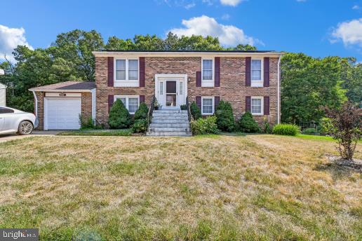 Tucked away on a quiet street in the sought-after Mary-Catherine Estates, this lovely all brick split-ranch offers the perfect blend of comfort, privacy, and convenience. With serene woods in the rear, a lush garden backyard, and thoughtful layout designed for easy living, this home is a true retreat from the everyday.
The main level is designed for one-floor convenience, featuring a primary bedroom with a private ensuite bath, two additional bedrooms, and a full bath. Central air conditioning keeps the home comfortable during hot DMV summer days. Relax on your screened-in rear porch — the ideal spot to enjoy morning coffee or unwind in the evenings while overlooking your peaceful, private backyard with a dedicated garden area that backs to mature woods. The lower level extends your living space with a spacious recreation area anchored by a cozy fireplace — perfect for movie nights, entertaining, or a playroom. A fourth bedroom and a half bath add versatility for guests, a home office, or extended family. The convenient interior-access garage completes the level, offering secure parking and added storage.
Enjoy the tranquility of a quiet, established neighborhood while staying connected to everything the region has to offer. Nearby parks and the historic Miller Farms provide wonderful outdoor recreation, while easy access to major interstates puts Washington, D.C. and the surrounding suburbs well within reach.
This wonderful home is being sold AS-IS. Bring your creative sensibilities to this home and make it shine. This is a wonderful opportunity to own a home with incredible potential in Mary-Catherine Estate. ****All Contract if any are due by 6/23 at 3pm****