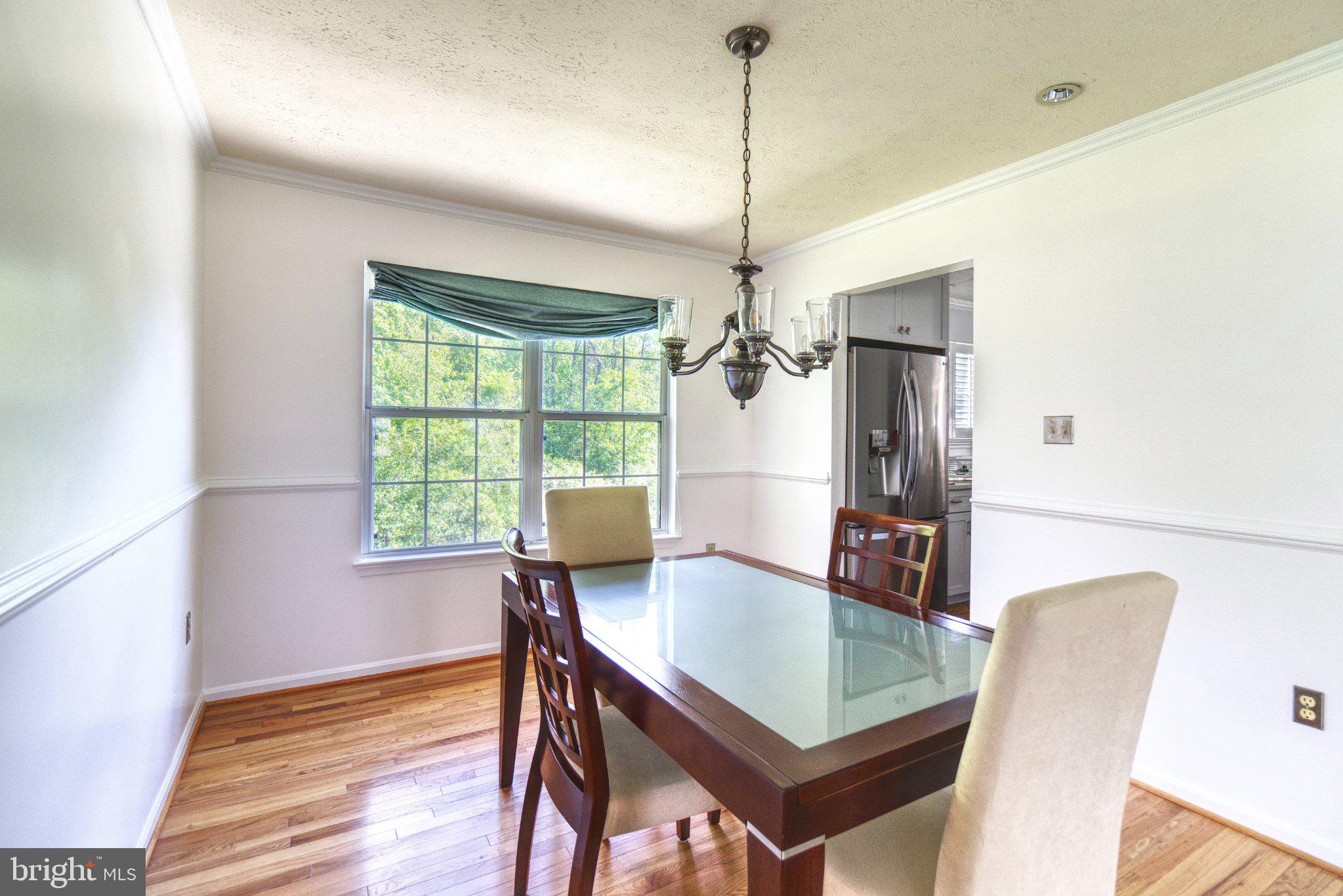 Nestled in the charming South Hampton community, this delightful Colonial home offers a perfect blend of comfort and style. With 1,760 sq. ft. of thoughtfully designed living space, this residence features three spacious bedrooms and two and a half bathrooms, ideal for both relaxation and entertaining. Step inside to discover a warm and inviting interior, highlighted by beautiful hardwood floors and carpet throughout. The combination dining and living area flows seamlessly into a cozy family room off the kitchen, creating an ideal space for gatherings. The kitchen boasts upgraded countertops, an island for additional prep space, and modern appliances, including a gas range and dishwasher, making meal preparation a joy. Enjoy the tranquility of your 0.31-acre lot, which backs to serene trees and is located on a peaceful cul-de-sac. The outdoor space features a welcoming porch and deck, perfect for morning coffee or evening relaxation. The South Hampton community is known for its friendly atmosphere and convenient access to local parks, schools, and public services. With easy access to shopping and dining, everything you need is just a short drive away. This home is not just a place to live; it's a place to create lasting memories. Experience the comfort and community spirit that South Hampton has to offer! Schedule your private tour today.
