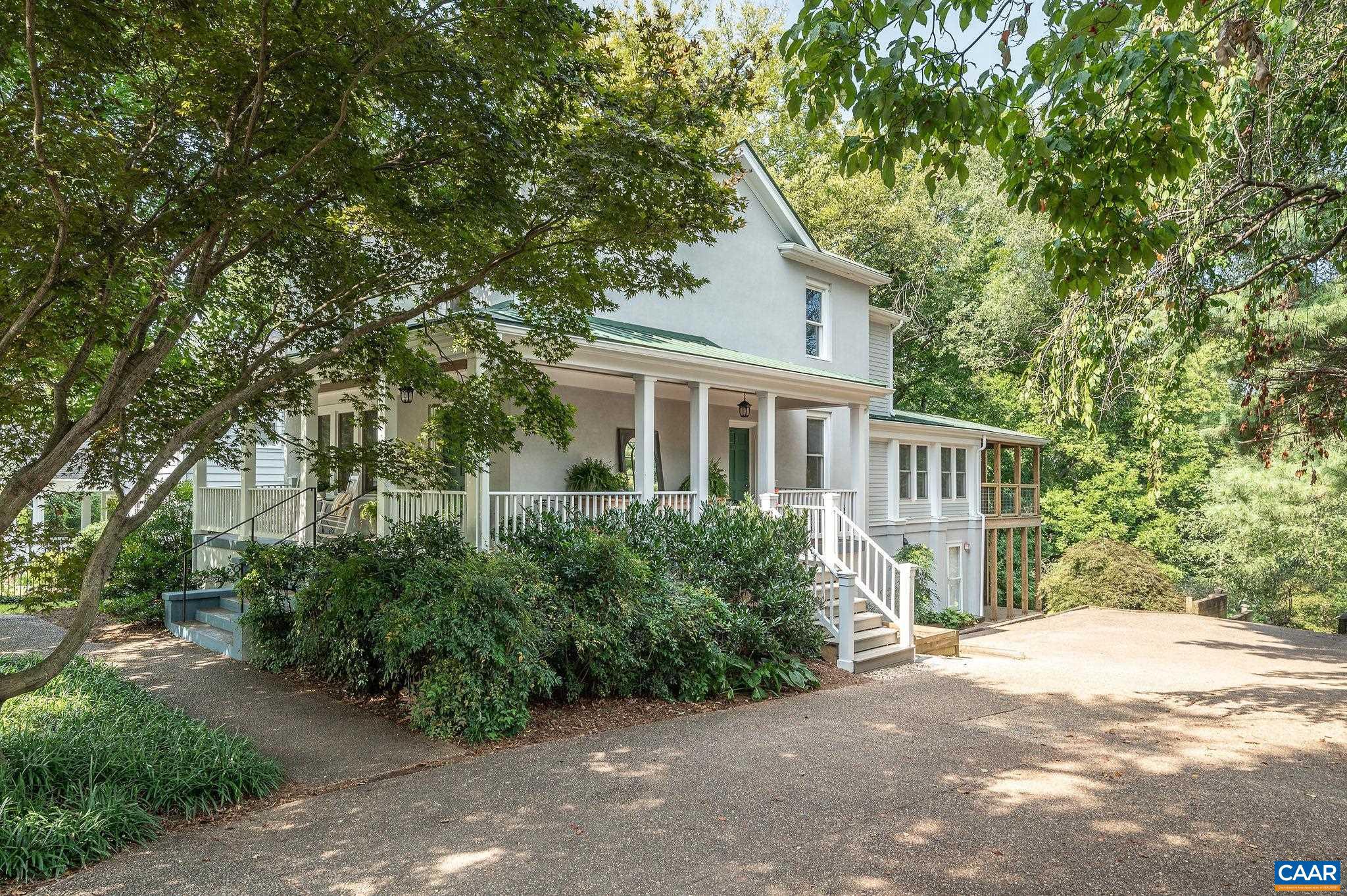 Fantastic newly restored and renovated farmhouse with large 1 bedroom ADU a short walk to the historic downtown mall. Built in 1900, you'll appreciate the original charm while enjoying all the modern conveniences. The spacious main level features an inviting foyer, living room, large dining room, family/breakfast room/kitchen with adjoining amazing expansive covered deck, powder room, mud room. The second level boasts 3 bedrooms, including a primary suite with 3 closets and a beautiful ensuite bathroom, a second full bath, laundry.  Use the terrace level as part of the house for in-laws/nanny or guest suite, or, as extra work space, or separate income producing 1,250 sf 1 bedroom apartment with living, dining, kitchen, office, full bath, laundry, foyer, outdoor patio. Large deep driveway is big enough for multiple cars and to turn around, plus abundant on street parking. Over .50 acre lot with mature trees, beautiful tree top views through a dell. 60/100 walk score. Less than a mile to the Historic Downtown Pedestrian Mall.,Painted Cabinets,Quartz Counter,White Cabinets