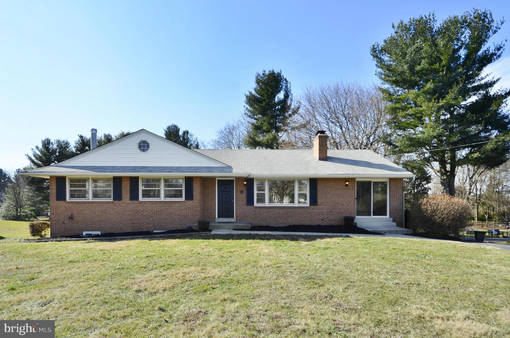 Beautifully renovated home on half acre.  New white quartz/stainless kitchen, updated baths, beautiful refinished hardwoods in most of main level. Family room open to kitchen breakfast bar. Wonderful deck overlooks large flat yard. Spacious lower level rec room with impressive wood-burning fireplace, full bath & 4th bedroom. New neutral carpet & paint. Plenty of driveway parking + oversized garage