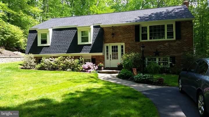This gorgeous home has custom 2 level bumpout which allows for a huge Master Suite w/door to multi-level trex deck (hot tub!) that spans the width of the home.  Remodeled home features gourmet kitchen with granite countertops, separate dining room open to living space, hardwood flooring, large bedrooms, and 3 full bathrooms.  Possible in-law, pellet stove, all on huge private lot. Crofton schools!