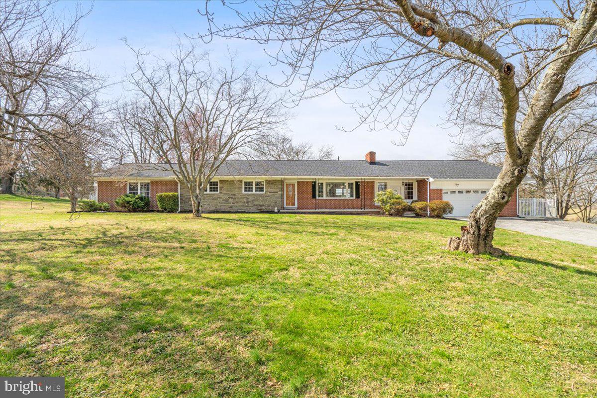 Welcome to 5406 Boyers Mill Road, a stunning property that seamlessly blends comfort, style, and functionality. Main level living and an entertainer/hobbyist's dream!

Spanning over 3000  square feet, this meticulously designed home features spacious bedrooms and well-appointed bathrooms, ensuring ample space for both relaxation and entertainment. The interior boasts elegant hardwood floors , adding warmth and character to the space.  Kitchen, Dining and Living spaces in the center of it all. Pride of homeownership can be noticed throughout the home with fresh paint, updated lighting and attention to detail!

The heart of this home is undoubtedly the primary suite, which is a true retreat with its French doors opening to the patio in the rear yard. It includes two walk-in closets providing generous storage options. The suite's design and layout offer a perfect blend of privacy and accessibility to the outdoors.

For those who love to entertain, there is a separate entrance at the front of the home, into what the current owners call, the Pool room,  as it leads you out to the Inground Pool!  This room is also accessed by the attached garage.  Consider making it your mud room when you're not entertaining.  Take the second driveway to the rear yard, where you will find Two detached garages, shed, chicken coop and more!

In the basement you will find a large rec room area with fireplace and storage!  Two additional bedrooms, and an additional kitchen with walk out exit.

This home is not just a residence but a lifestyle choice, offering everything one could desire for comfortable living and entertaining. Don't miss out on the opportunity to make 5406 Boyers Mill Road your new home!