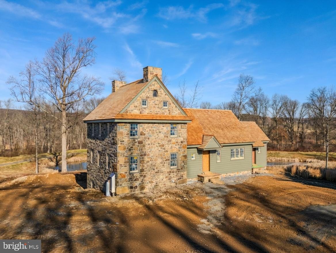 BUY EARLY AND MAKE IT YOUR OWN. This fully custom home at Olde Bulltown Village will be under construction as a model home, but you have the opportunity to buy this lot and design prior to that and own every detail. Talk to us about your timing and walk the lot in person. Tucked on the Northern side of the community with a buffered overlook of the private French Creek Golf Club and a wooded backdrop, this home offers a daily retreat of seclusion and beauty. Not familiar with Olde Bulltown Village? Chester County’s luxury custom home community offers authentic 18th century architecture using the finest building materials combined with 21st century amenities. The exterior of the homes displays architectural detail according to community guidelines, ensuring the integrity of the homes. The interior of the homes is yours to personalize every detail and selection. Surrounded by French Creek Golf Club and preserved farmland, this pristine community offers the best of Chester County’s natural beauty and the best home quality for the most discerning buyers. French Creek Golf Club is a private club and the course is designed by renowned architect Gil Hanse. Call us for information on this quick-delivery home, or to see other available lots.
This home is DECKED OUT with the finest exterior and interior finishes and materials!
EXTERIOR INCLUSIONS:
-Reproduction beaded & beveled painted wood siding over ¾” lath
-Locally sourced Chester County fieldstone laid in an 6” veneer over rain screen
-Cedar shingle roof installed over cedar breather
-Marvin Ultimate aluminum-clad exterior windows and porch door
-Cedar shutters with reproduction hardware
-Bevolo copper light fixtures
-Full color natural cleft bluestone stoops
-Handmade oversized brick walkways
-Reproduction beadboard porch ceiling
-Thermally treated wood railing with individual cutouts.
INTERIOR INCLUSIONS:
-Hardwood floors
-Tile in bathrooms
-Real brick tile in mudroom
-Walk-in tile shower in master
-Custom cabinetry
-Soapstone countertops
-Paneled refrigerator and dishwasher
-Custom lighting
-Beadboard ceiling over kitchen and dining room
-Gas fireplace with raised panel surround ft. paneled doors over a TV recess
-6-panel raised panel wood doors
-Emtek hardware
-Highly efficient geothermal heating & cooling
-Custom shelving in master closet 
-Custom shelving and beadboard in mudroom