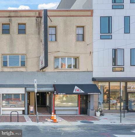 Located just off Broad St in the heart of Philly's vibrant East Passyunk neighborhood, this 3-story, mixed-use property includes a commercial unit on the first floor and second-floor rear, plus a bi-level updated 2 bed plus den, 2 bath apartment on the upper floors. The commercial unit is currently leased on a net basis as a martial arts studio and offers a reception area, open studio areas, a full finished basement, and two restrooms. There is also studio space on the second floor at the rear which offers the potential for conversion to an additional apartment unit.  A separate door by the front entrance leads to a staircase and the bi-level apartment above. The unit has newer carpeting and laminate floors, fresh paint throughout, a large living room, a modern kitchen with a dishwasher, in-unit laundry, spacious bedrooms, a den, and two full bathrooms. The units also have gas forced-air heat and central air. 1841 E Passyunk Ave is surrounded by top-rated restaurants, coffee shops, and entertainment, earning it a near-perfect walk score of 98! Sprawling parks and friendly neighbors create a welcoming feel for both visitors and residents. A few blocks away, the Bok Building acts as a community hub with a mix of local businesses, plus Constitution Health Plaza has various medical offices around the corner. There's also easy access to public transit, the sports complex, I-76, I-95, and South Jersey. Schedule your tour today!