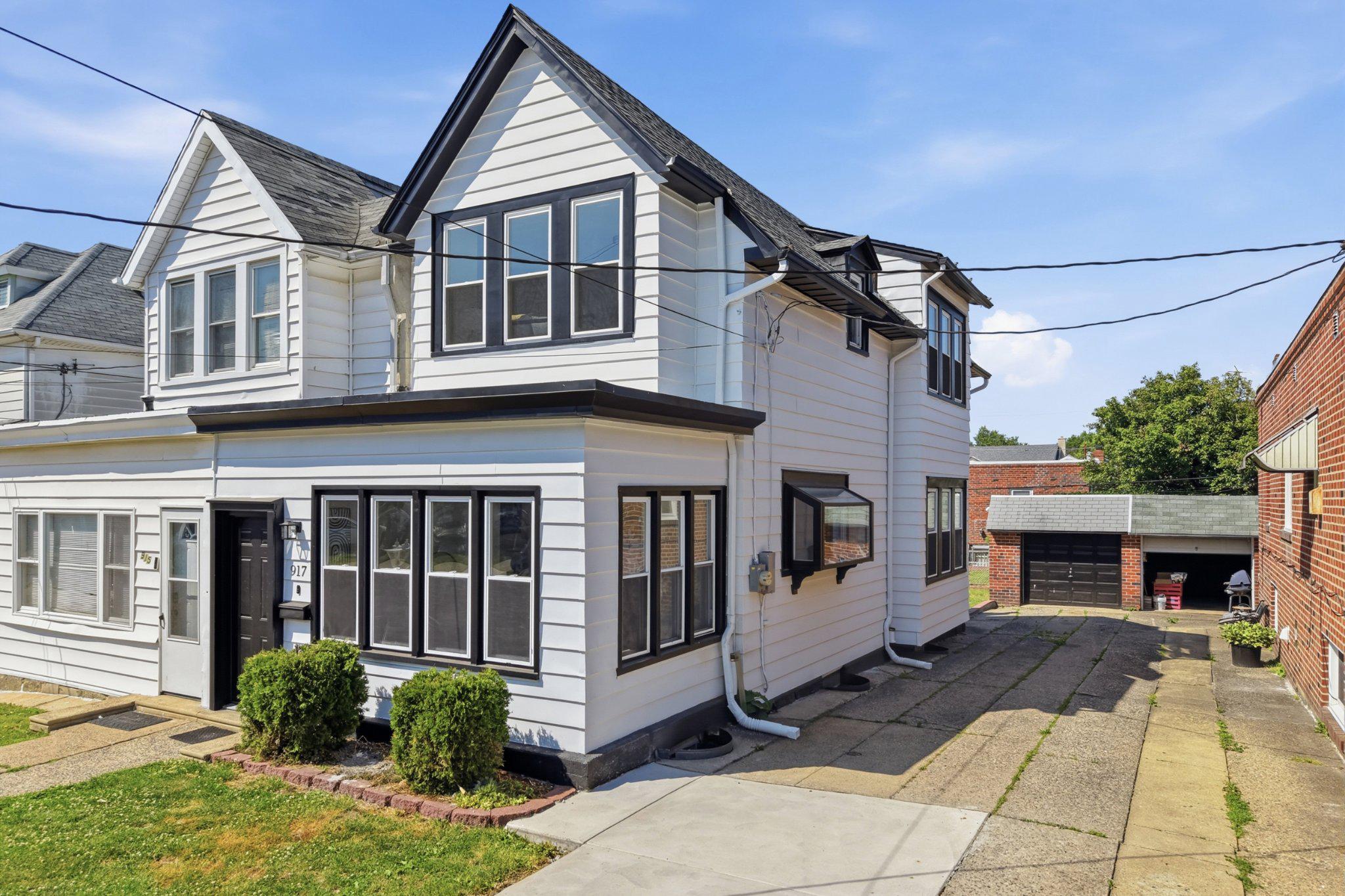 Welcome to 917 Oakmont Street, a beautifully renovated twin home located in the highly sought-after Fox Chase section of Northeast Philadelphia. This move-in ready gem combines modern updates with timeless charm and is sure to impress from the moment you arrive. Step inside through the enclosed front porch and into a bright, inviting living room that flows seamlessly into the spacious dining area and stunning new kitchen. The kitchen has been completely updated and features quartz countertops, modern white cabinetry, stainless steel appliances, and a stylish backsplash. Upstairs, you'll find three generously sized bedrooms and a beautifully updated full bathroom. The lower level offers a clean, modernized basement providing excellent storage space or the potential for additional living space. Outside, the property boasts fantastic curb appeal, an updated concrete driveway, detached garage, peaceful backyard, and a welcoming neighborhood atmosphere. Major improvements include brand-new electrical wiring throughout the entire home, a new heating and central air conditioning system, new flooring, a fully renovated kitchen, and numerous additional upgrades that provide peace of mind for years to come. Conveniently located near parks, shopping, local bakeries, public transportation, and major commuter routes, this home offers the perfect combination of comfort, convenience, and value. Rarely does a fully renovated home in Fox Chase become available at this price point. Schedule your private showing today before this incredible opportunity is gone!