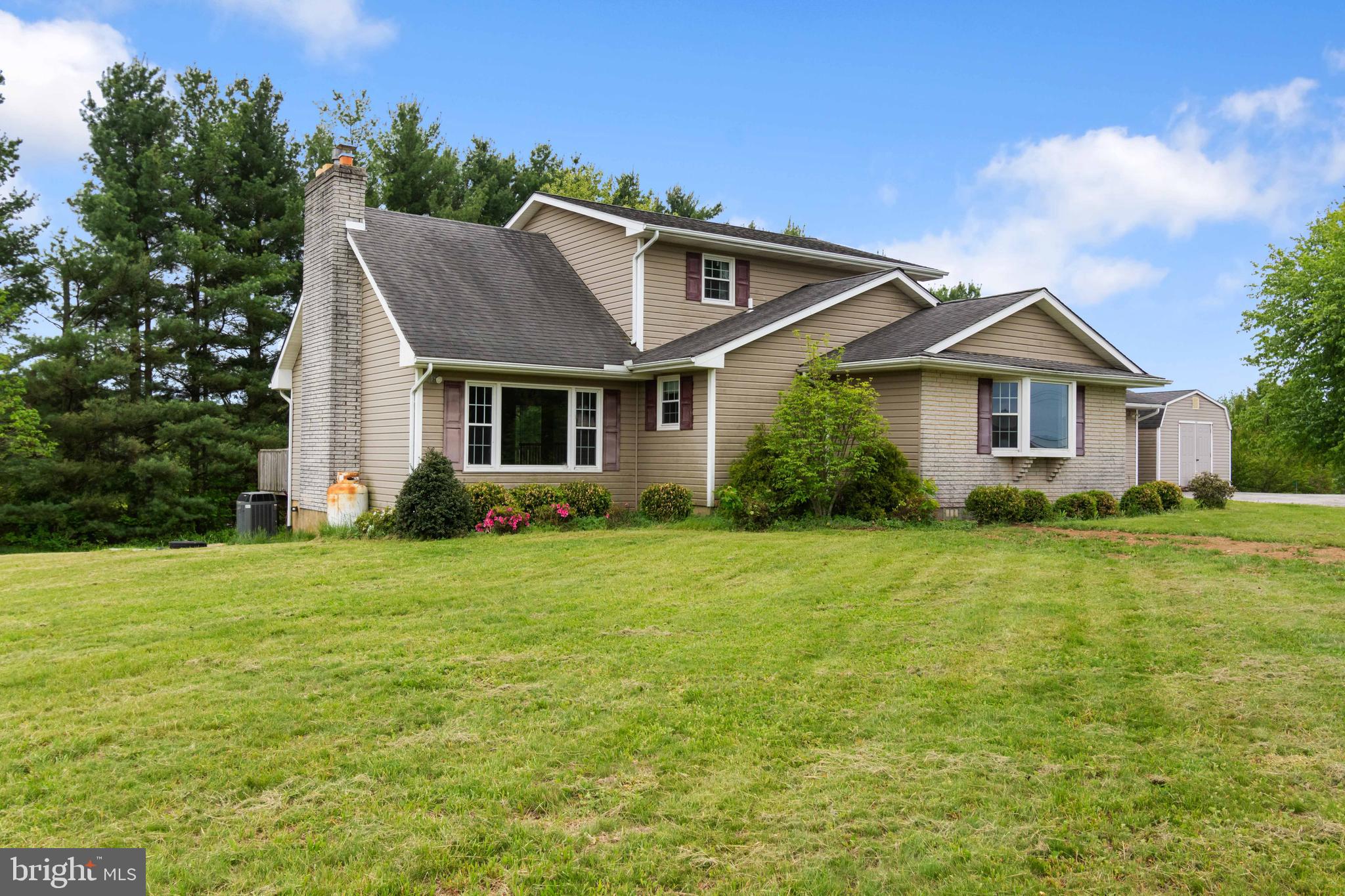 Rolling countryside of Westminster, this home at 1525 Bachman's Valley Rd offers the kind of setting people move for but rarely find. Surrounded by natural beauty and just minutes from outdoor favorites like Bear Branch Nature Center and Hashawha Environmental Center, the location strikes that perfect balance between peaceful and connected.
Inside, the home opens up with a dramatic cathedral ceiling that creates an airy, expansive feel the moment you walk in. Natural light pours through the space, highlighting the warmth of the fireplace that anchors the main living area and makes it feel instantly inviting.
Step outside onto the deck and you’ll understand what makes this property special. The view stretches out over the surrounding landscape, offering a private, elevated perspective that’s ideal for morning coffee, quiet evenings, or hosting friends.
If you’ve been waiting for a home that combines scenic surroundings, standout architectural details, and everyday comfort, this one delivers in all the right ways.