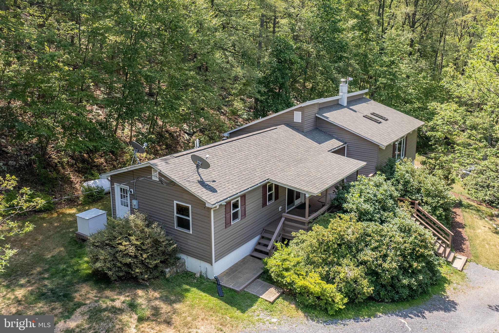 PRICE ADJUSTMENT.    Peace and quiet awaits you far from the fast pace of the hustle and bustle of everyday life.  There is so much to offer here, including an abundance of wildlife,  flowering shrubs and trees such as azaleas, rhododendrons, mountain laurel, and fruit.   Five unrestricted acres, (no HOA),  with a personal target/shooting range, roads and paths to explore on your four wheelers, and wet weather streams where the water flows directly out of the mountain.  This home is close to the Tuscarora Trail and five minutes from The Cove Campground , which has camping, boating, swimming, fishing, and off road events.  These are just a few of the reasons why the sellers,  the one and only family, have lived here for over 40 years.   170 Frye Path Road could be your full time residence, second home in the country, or an Air B and B.    The sellers have taken it upon themselves to prepare the home to be move in ready for any buyer.      (See the list of updates/improvements under documents).  The interior of the home is spotless from top to bottom.   Come and check out this wonderful home and property  today.  (Please note security cameras are on premises)