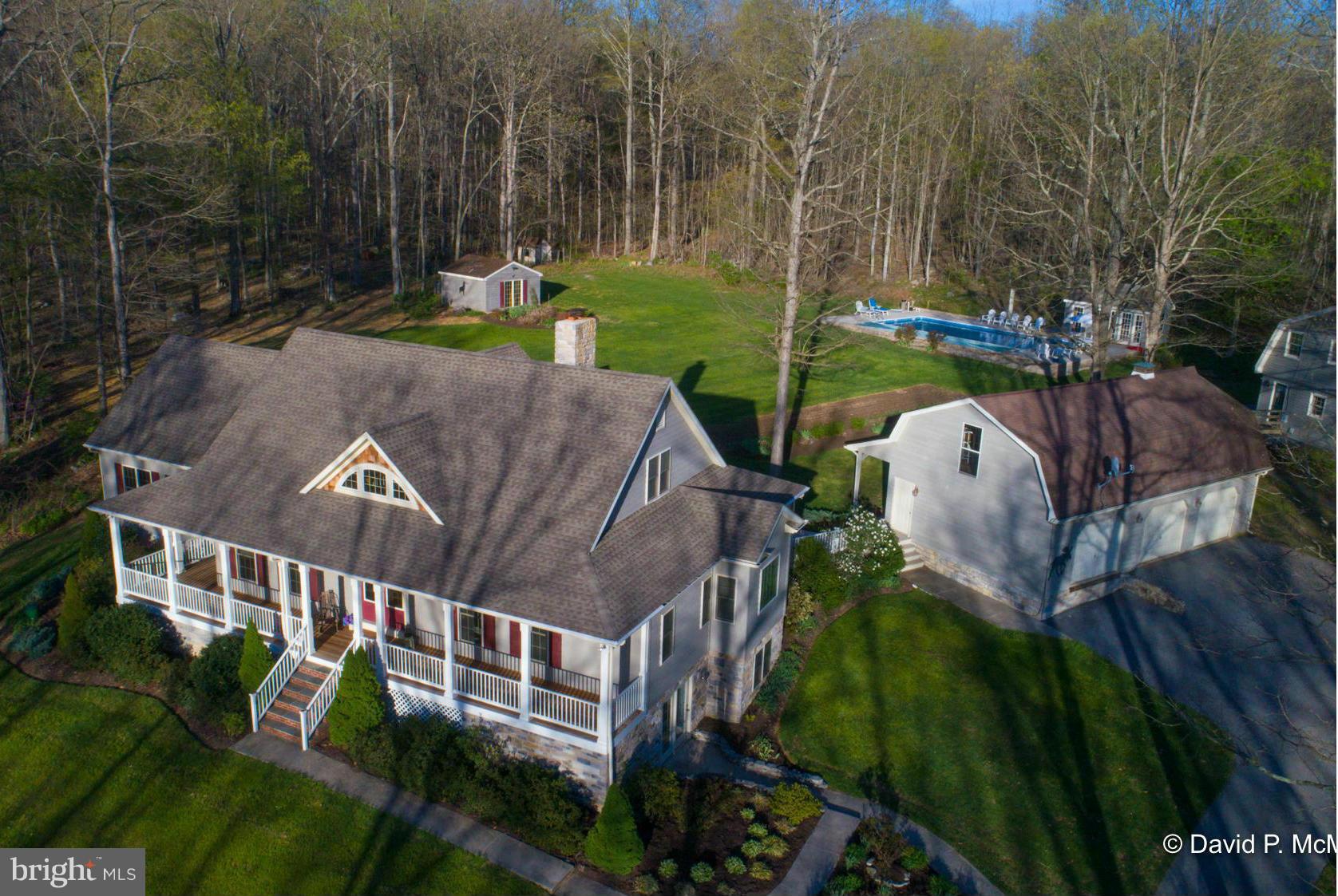 Impressive family compound, home of highly regarded builder. Two homes, elegant cedar home, second older, handsome red wood guest house.  In-ground pool, det. 3 car gar.  Highest quality. Finished bsmt, screened porch, big main level Master Suite. Fabulous kitchen, big living room w/fp, home office. Nice mt. views. Private. Beautifully landscaped. Meticulously cared for. Great value.