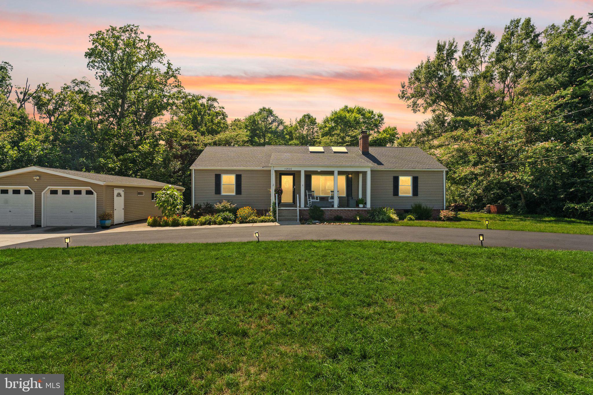 This beautiful move in ready, Lorton home sits on a one-acre lot just minutes from Fort Belvoir, the Lorton VRE, I-95, and the Capital Beltway.  Recent improvements include a new roof on both the home and garage, new HVAC system, remodeled bathroom, new driveway, upgraded siding, whole house generator, and new lighting throughout. The timeless brick exterior adds curb appeal while the expansive property offers space rarely found this close to Washington, D.C. 

Located approximately 5 minutes to I-95, 10 minutes to I-495, 10 minutes to the Lorton VRE, 12 minutes to Fort Belvoir, less than 10 mins to ample shopping and restaurants, and about 30 minutes to Washington, D.C., this home provides exceptional commuter convenience while still offering the peace and quiet buyers are searching for. 

This property provides 3 bedrooms on the main level with a 4th optional bedroom or studio, a beautifully designed open concept floor plan with an abundance of storage. Beyond the home itself is something money can’t buy, a true neighborhood community. Friendly neighbors, peaceful surroundings, and Saturday mornings with fresh eggs and home baked goods from the neighbors that create a lifestyle that’s hard to find in Northern Virginia. 

Live just minutes from Belmont Bay, the Potomac River, Mason Neck State Park, and Pohick Bay Regional Park, where weekends are spent kayaking, boating, fishing, hiking, horseback riding, golfing, or watching bald eagles soar overhead. Few Northern Virginia communities offer this combination of nature, water access, and commuter convenience. If you’ve been looking for an updated home with land, privacy, modern mechanical systems, an oversized detached garage, commuter convenience, water access and a neighborhood that feels like home, 10600 Belmont Blvd is the one.