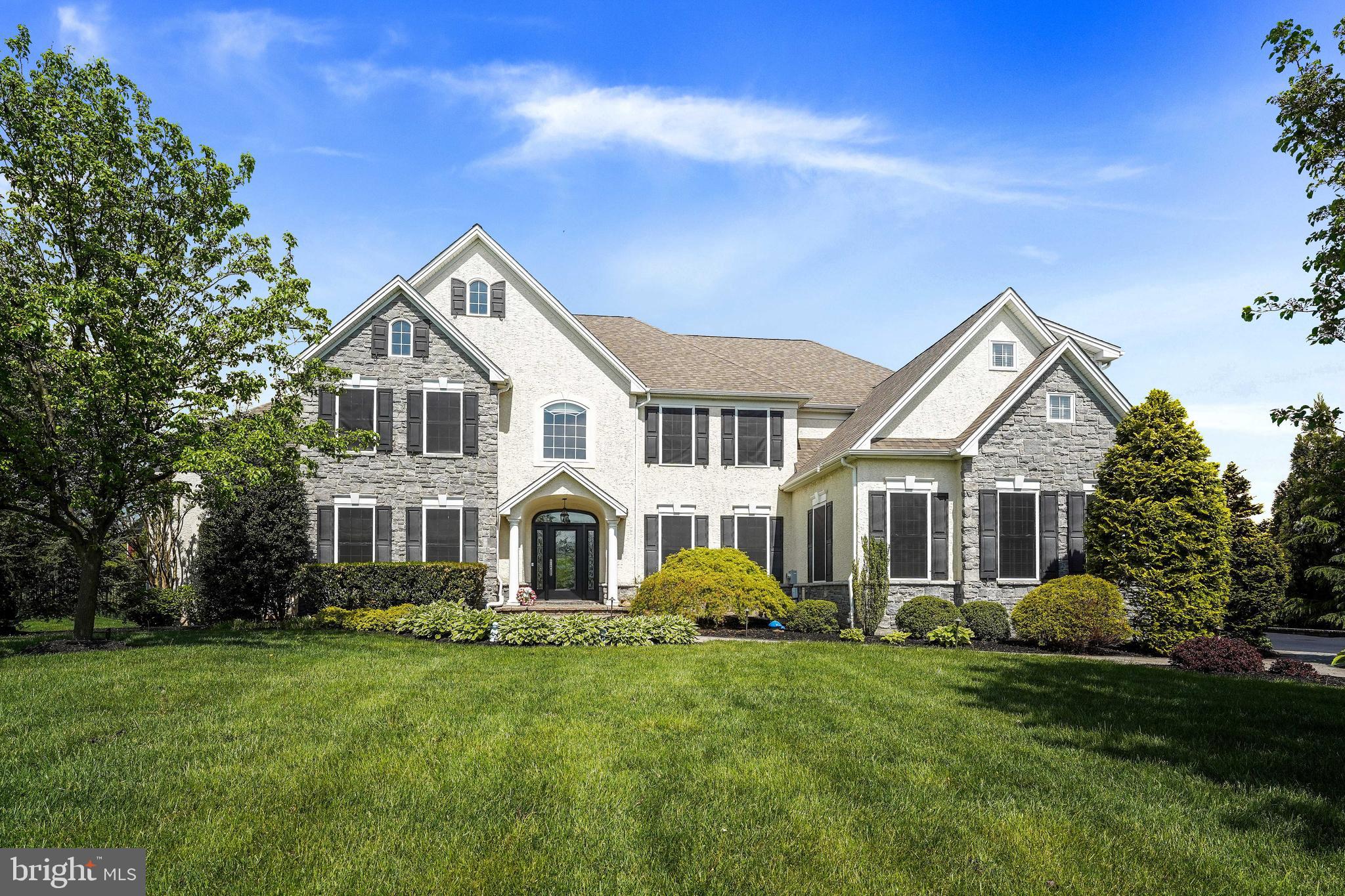 Discover unparalleled luxury in this exceptional executive home located in the highly acclaimed Garnet Valley School District. Situated at the end of a cul-de-sac on one of the largest lots  in the prestigious Greystone community, this 6 Bedroom, 4.5 Bathroom home offers over 7000 sq. ft. of living space and truly has it ALL...from the perfect, level, secluded lot, to the sun filled open floor plan with designer details and upgrades throughout. to the incredible outdoor oasis that is sure to please even the most discerning buyer. Enter from the EP Henry paver walkway that leads to a custom front door, welcoming you into an expansive  grand foyer adorned with gleaming cherry hardwood floors that flow throughout the Main Level. The formal Living and Dining Rooms exude sophistication, featuring wainscoting, 2 piece chair rail and crown molding. Open side hall leads to the Conservatory with 14 ft. ceilings, stunning palladium windows, and French door to covered side porch. Main floor Office with double six panel doors and two sets of corner windows offers an ideal workspace. Gourmet Kitchen with 42-inch cherry cabinetry, an oversized island (with seating for 4), a five-burner gas cooktop, and a large pantry. Adjacent to the Kitchen , the Family Room boasts vaulted ceilings, a wall of windows, and a wood burning fireplace with a marble surround.  The Morning Room. that is open to both the Kitchen and Family Rooms, is bathed in natural sunlight and has a triple window and slider that opens to the spectacular Back Yard Retreat. Step outside onto a raised and covered flagstone patio with a tray ceiling and metal roof (2018), complete with a built-in outdoor kitchen, perfect for al fresco dining and entertaining. The custom heated saltwater pool (40'x20') showcases triple waterfalls and an expansive paver surround, offering a private sanctuary overlooking open space and the original farmhouse and barn. A built-in firepit with seating enhances the outdoor entertainment options. The open front or back staircases lead to the Second Level that features a luxurious Master Suite with a sitting area, his-and-hers closets and a five-piece Master Bath with a jetted soaking tub, separate vanities, and an expanded fully tiled walk-in shower. Four additional generously sized Bedrooms, two full bathrooms (one Jack & Jill), and a convenient second-floor Laundry Room complete this level. The fully finished, walk-out Lower Level offers extensive additional living space, including a spacious Game Room, a two-tiered wet bar with double wine coolers, icemaker, refrigerated drawers, and tumbled stone flooring, Media Room (18x14), and Exercise Area. This level also hosts a sixth Bedroom featuring a double closet and an additional sitting area, accompanied by a full bath, ideal for guests or extended family. The extensive list of upgrades and amenities also include an oversized three-car Garage, (new) Pella doors throughout, (new) HVAC (2 high efficiency units-2020), updated outdoor lighting, and an irrigation system (to name a few).  The prime location of this home provides easy access to major highways, Philadelphia Airport, and Downtown Wilmington. Schedule your private appointment today to tour this remarkable property.