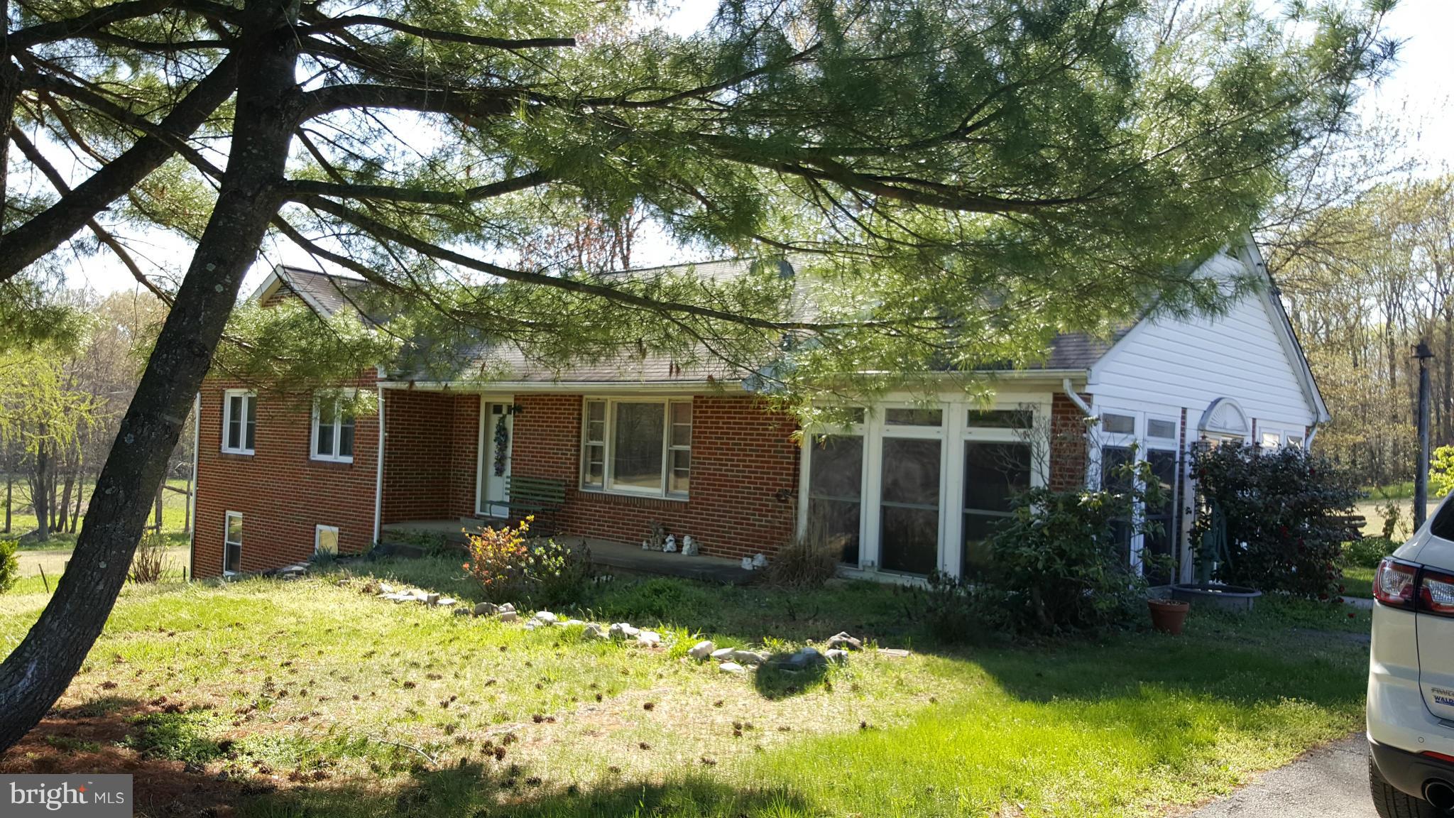 Awesome Property! 52+ acres.  2 ponds, flat cleared area, some wooded, House in Good Condition.  All Brick Rambler with Full Basement.  Enclosed sunroom, 3 Full Baths, 4 Bdrms, partially finished bsmt, walk-up attic space, hardwood floors main level, detached 2 car garage, Second Home at the Property for Sale also CH9660653 with 4 acres! Could work great for a second family + more