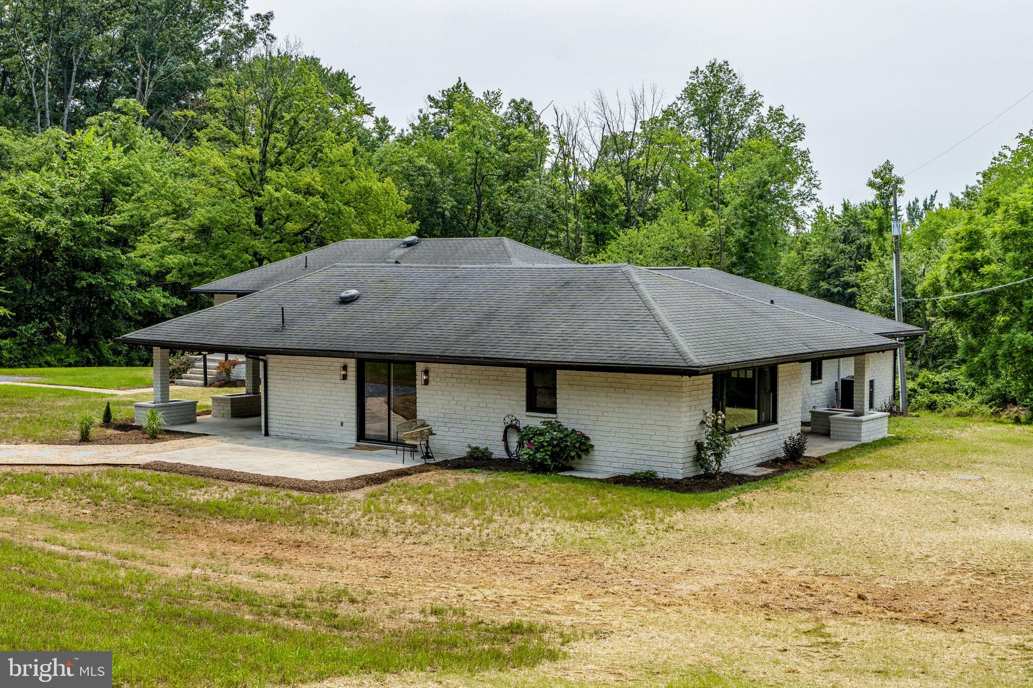 Welcome to an exceptional and versatile 2-acre property nestled in the peaceful countryside of Lancaster County, offering a rare combination of privacy, modern updates, and outstanding income potential. Beautifully renovated in 2026, this unique property features two separately metered ranch-style homes, making it an ideal opportunity for investors, owner-occupants, multigenerational families, or those looking to offset their mortgage through rental income.
The primary residence has been completely remodeled and offers single-floor living with an open-concept layout, featuring 4 bedrooms and 2 full bathrooms. Modern finishes, spacious living areas, and thoughtful updates create a move-in-ready home designed for today's lifestyle.
The adjoining residence offers an updated 2-bedroom, 1-bathroom floor plan and is currently leased for $1,550 per month on a month-to-month lease, providing immediate rental income while allowing flexibility for future use.
Extensive capital improvements have already been completed, including a new septic system, central air conditioning, partial roof replacement, updated windows, giving buyers confidence in the property's long-term value and reducing major maintenance concerns.
Adding even more value, the property includes a third separately metered unfinished basement with exciting potential for future conversion (subject to municipal approvals), as well as a three-bay garage/shop featuring high ceilings. Whether utilized for personal storage, a workshop, business use where permitted, or leased to generate additional income, these spaces provide exceptional flexibility and future upside.
Surrounded by mature trees and tucked away in the woods of Denver, this property offers a peaceful, secluded setting while remaining just minutes from Route 222 and the Pennsylvania Turnpike, providing convenient access for commuters.
The possibilities are truly endless. Live in one home while the rental income helps offset your mortgage. Expand your investment portfolio with multiple income-producing opportunities. Create the perfect multigenerational living arrangement where family members can enjoy both independence and close proximity. Or simply enjoy a beautifully updated home on a rare 2-acre wooded property in one of Lancaster County's most desirable locations.
Properties offering this combination of acreage, multiple living spaces, extensive renovations, separate utilities, income potential, and future expansion opportunities are exceptionally hard to find. Schedule your private showing today and discover everything this one-of-a-kind property has to offer.