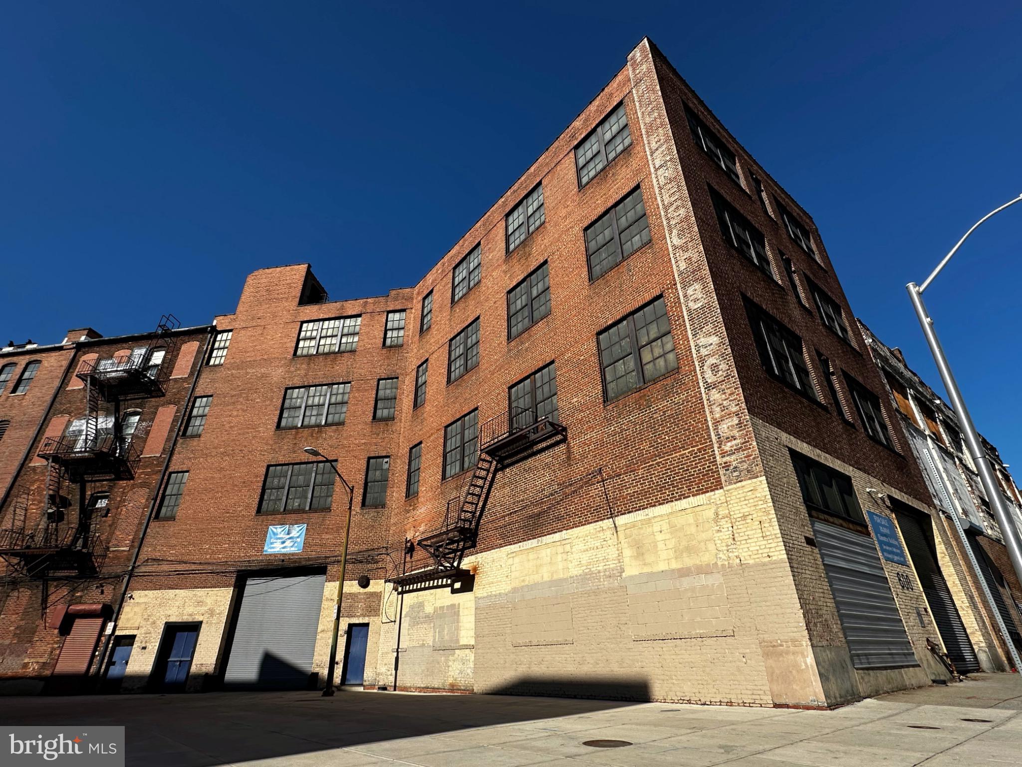 Large C-2 zoned commercial building just east of Downtown Business District and just west of Johns Hopkins Hospital with panoramic city views.  Zoning allows for a mix of commercial and residential uses.  Solid concrete, steel, and masonry construction.  Easily converted to Residential, Office, Retail, medical, institutional, hospitality, or other special use.  Ideal for either an owner-user or investor.  Current use is warehouse and office, and is in good condition for its age.  Building has multiple entrances, drive in, loading, and is serviced by a freight elevator.  May be eligible for a myriad of tax incentives.  360 degree city views from the rooftop are breathtaking.