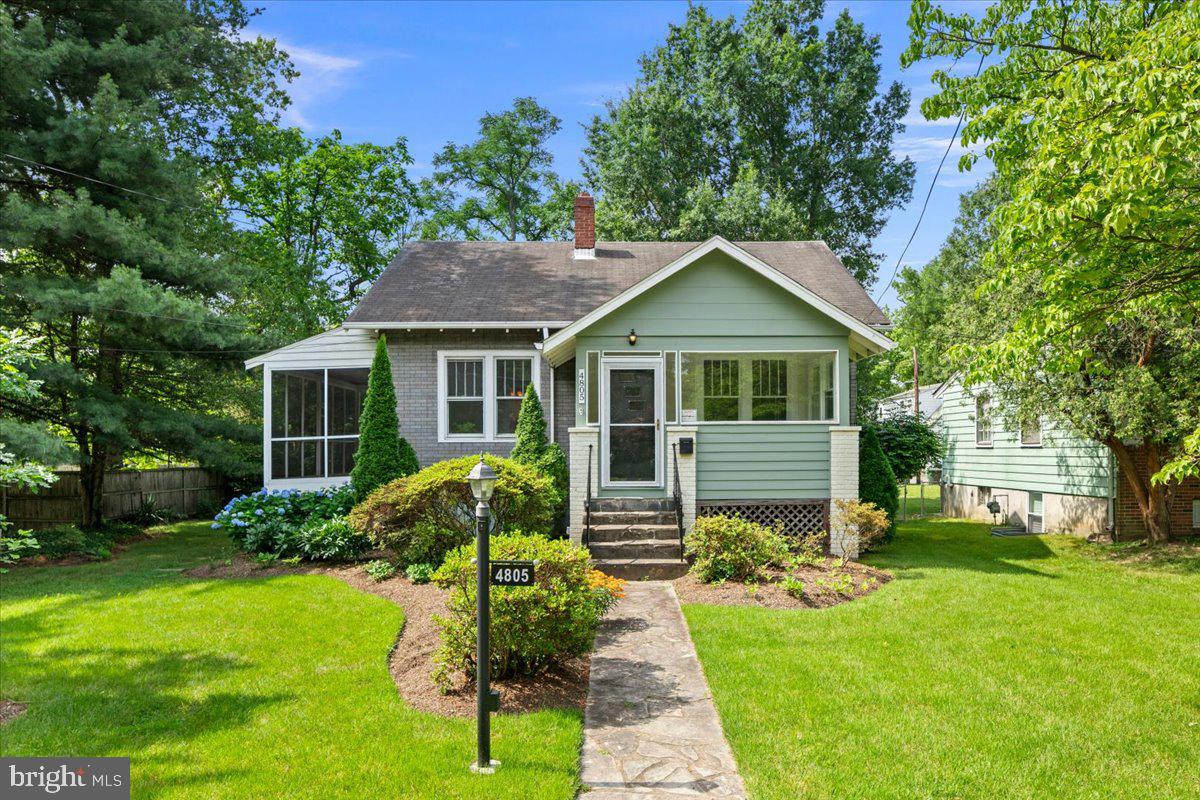Step into a living piece of American history. Built from a Sears Kit Home and delivered by rail directly to the end of Calvert Road, this beloved bungalow has sheltered five generations of the same family and is now being offered to the public for the very first time.

Nestled in the heart of Historic Calvert Hills, where tree-lined streets give way to quiet trails and a true sense of community, this home greets you with mature, lush landscaping that frames a warm and welcoming path to the enclosed three-season porch - a perfect perch for every season.

Walking in, you're greeted by warm wood floors and a lovely living room that sets the tone for the craftsmanship found throughout. The separate dining room and large windowed kitchen, complete with a pantry and stainless steel appliances, both open directly onto the charming screened porch, making indoor-outdoor living effortless whether you're hosting dinner or savoring a quiet morning coffee. Soaring ceilings, rich detailed millwork, and original hardwood floors tell the story of a home lovingly preserved, while the updated kitchen and bathroom bring it seamlessly into the present. The main level also offers a bedroom, full laundry, and easy flow between spaces.

Upstairs, two additional bedrooms and two generous storage areas round out the upper level. The unfinished lower level provides abundant storage today and exciting possibilities for tomorrow.  Dual zone cooling ensures year-round comfort on every level.

Out back, a detached storage building (original garage), off-street parking for two-plus cars, and an extra half-lot create rare outdoor space: mature trees, room to garden, and room to breathe.

Then there's the location. Steps from the College Park Metro (Green & Yellow Lines, with Purple Line expansion coming), the MARC Train, Trader Joe's, Whole Foods, Target, gyms, coffee shops, and restaurants are all within walking distance. Minutes from the University of Maryland's main campus, Route 1, I-295, and I-495, with easy access throughout Maryland, Washington, D.C. and beyond.
