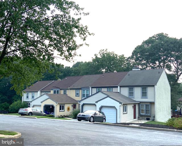 OPEN HOUSE- WEDNESDAY, JULY 22nd, 5:00-7:00PM and SATURDAY, JULY 25th, 12:00-2:00 ....
PROFESSIONAL PICTURES COMING SOON

Welcome to this beautifully updated Pennell Place townhome, perfectly situated in a serene yet convenient location.
As you enter the main level, you're greeted by a stunning kitchen featuring granite countertops, ample pantry space, a garbage disposal, a trash compactor, and a large island that seamlessly connects the kitchen to the dining area. The dining area flows effortlessly into the cozy family room, complete with a fireplace and sliding glass doors leading to the deck. From this private outdoor retreat, enjoy breathtaking views of lush greenery, wooded surroundings, and local wildlife.
The main level also includes a convenient half bath.

Upstairs, you'll find two spacious bedrooms, both bedrooms offering ample closet space and its own private full bathroom. The conveniently located second-floor laundry area makes everyday living even easier.

The fully finished basement expands your living space and features a second fireplace, recessed lighting, a half bath, and an exterior exit to a private patio—perfect for entertaining or relaxing.

Additional highlights include a garage, a private driveway, extra parking in the cul-de-sac for you and your guests. The HOA covers common area maintenance, lawn care, snow removal, trash service, making for truly low-maintenance living.

Come experience the comfort, convenience, and peaceful setting of this well-maintained home!