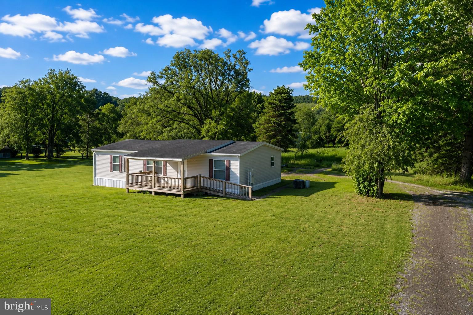 Welcome to 635 Dennett Road! This beautifully maintained 2023 home offers the perfect opportunity to enjoy convenient living on 5 acres with a large yard. The expansive, level yard provides endless possibilities for outdoor entertaining, gardening, or simply relaxing. Inside, you'll find an open floor plan with bright finishes, a spacious kitchen, and comfortable living spaces designed for both everyday living and gathering with family and friends. Lovingly cared for, this home is truly move-in ready. Located just behind Southern High School and only minutes from town, you'll enjoy the tranquility with the convenience of nearby  shopping, dining, and everyday amenities.