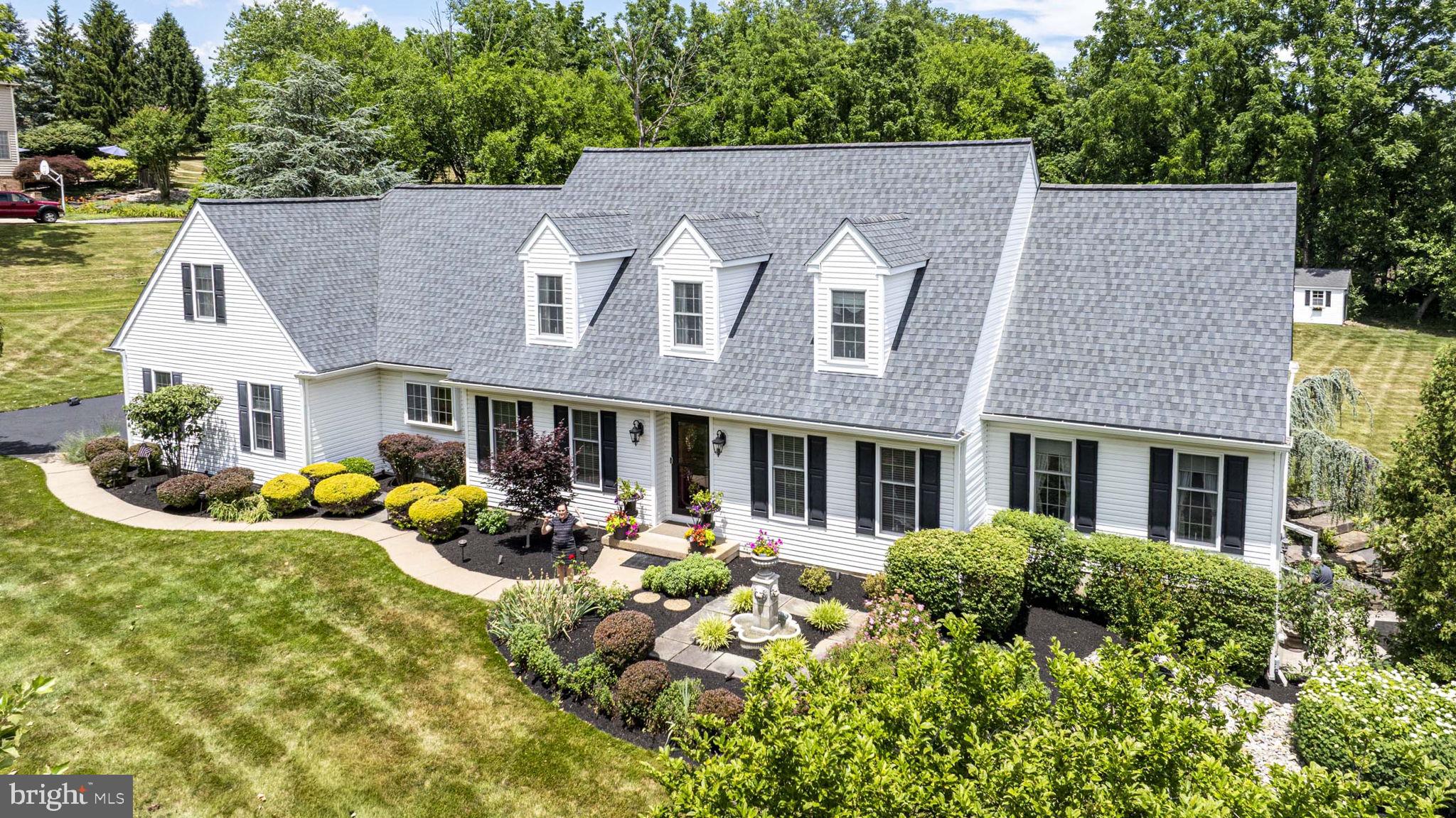 Welcome to 4717 Essex Drive . . . a classic 3,000 sq ft Cape Cod built by esteemed homebuilder, Richard Zaveta.  It’s perfectly nestled in one of Doylestown’s most desirable neighborhoods, Fox Hunt Estates. Offering the ultimate blend of traditional charm and spacious, modern living, this lovely home sits on a magnificent, park-like 1.38-acre lot backing to a beautiful gentleman’s farm.  Inside, the light-filled layout features generous living spaces, classic architectural details, and a seamless flow ideal for both daily living and effortless entertaining. The heart of the home is the kitchen and it features stainless steel appliances, granite countertops, a large two-tiered island with utility sink, a beverage refrigerator, and so much more.  The adjacent breakfast room opens up to serene views of the expansive and private backyard, offering a peaceful retreat just minutes from the vibrant heart of Doylestown Borough.  The main level also features the primary suite with hardwood floors, volume ceiling, dual walk-in closets, and a stunning primary bath with radiant heated floors, a sumptuous soaking tub, large, tiled ADA-compliant shower with frameless shower door, and a dual vanity.  Upstairs are three generously-sized bedrooms and two full baths, as well as a loft space above the family room.  Let’s not forget the finished basement which includes a built-in bar with ample storage and a refrigerator, a built-in entertainment center, a separate room ideal as an exercise space or private office, and a French door leading outside to a lovely “secret garden” with sitting area and wiring for music. The basement also provides abundant unfinished space for storage.  With ample square footage, beautifully proportioned rooms, and a premier location within the award-winning Central Bucks School District, this home presents a unique opportunity to enjoy Bucks County living at its absolute finest. Schedule your private tour today!