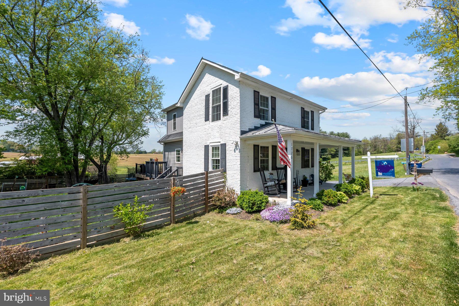 Move-in ready 3BR/2.5BA expanded Farm home located in the countryside of Westminster.  Parking is ample in the long double wide driveway as you make your way past flowering shrubs to the adorable covered front porch of your new home. Step into a beautifully maintained home featuring hardwood floors, an exposed brick wall, and so much character.  The main floor features a mudroom with custom built cubbies, a large living room, a beautiful kitchen, and a sunny dining room with built-in window benches.  The kitchen features stainless steel appliances, plenty of cabinets, a pantry closet, granite countertops with a subway tiled backsplash to the ceiling, and an island with a stainless farm sink with a butcher block countertops, and breakfast seating for three or more.  In addition, the main floor offers a half bath and a laundry room.  On the second floor are two sizable secondary bedrooms, a full bath with tile from tub to ceiling, and a spacious primary bedroom.  The primary features a large walk-in closet and a private full bath with a walk-in shower.  There is an unfinished cellar which can be accessed from the outside and host utilities.  From the living room, sliding doors take you to a large wrap-a-round trex deck that overlooks the tons of green space and shade trees surrounded by open land. In addition, the yard features raised gardening beds all ready for your summer garden, and a detached garage/shed. This home is move-in ready with so much to offer new homeowners including being located within walking distance to the Old Westminster Winery, and in close proximity to shopping, restaurants, and commuter routes.