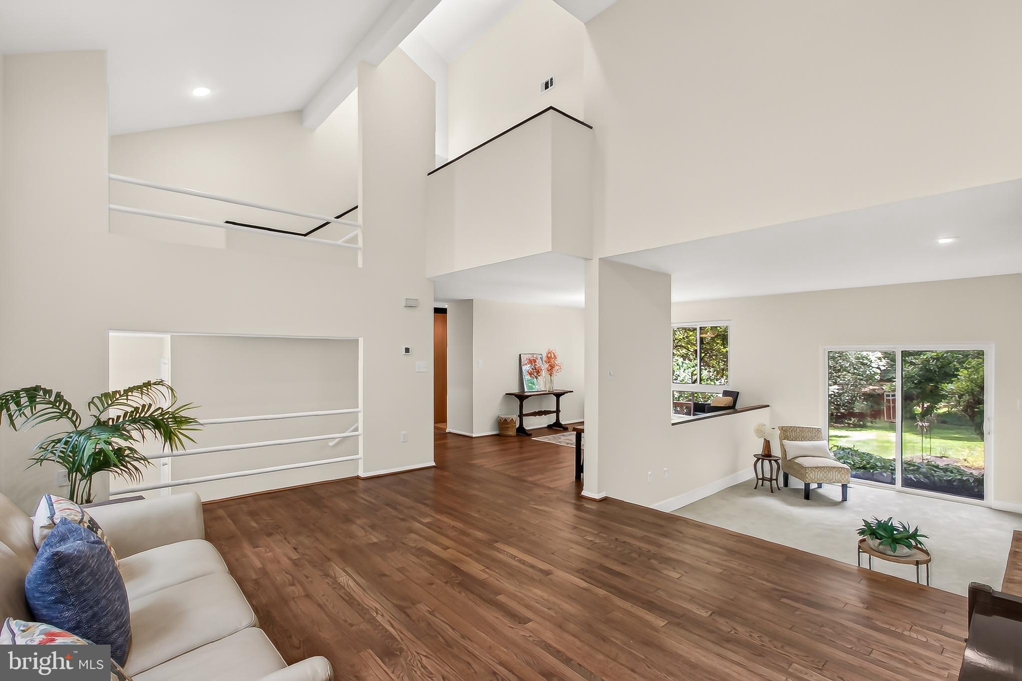 Ever wanted to live in a fairytale cabin in the woods *and* a contemporary masterpiece?  Welcome to 3219 Foxvale Dr in Oakton! Tucked away off a quiet tree-lined street, the understated cedar exterior draws you inside — to soaring ceilings, light streaming through strategically-placed skylights (even in the garage), whimsically placed windows magnifying the natural views, and more! From the moment you enter, you're greeted with a spacious open living area, featuring gorgeous wood floors, modern lighting, and more! The modern, flexible floorplan will suit small quiet moments, as well as large gatherings, with an open dining room opening to a cool conversation corner accented by a brick gas fireplace. A fabulous artistic kitchen in the heart of the home features upgraded countertops, natural stone & tile backsplash and stainless steel appliances, ideal for gatherings, or having a quiet dinner at home. The combination kitchen and dining area is perfect for hosting, while the beautifully integrated family room with a 2nd gas fireplace creates an cozy atmosphere for everyday living.  Step outside to enjoy the outdoors on the expansive deck, perfect for al fresco dining or simply soaking in the serene views of the surrounding trees and woods. Back inside, the main level is complete with a full bathroom, accessible laundry area, storage, and easy access to a huge 2 car garage with updated flooring. Moving upstairs, the generously-size primary suite features a brick wood-burning fireplace, a spacious walk-in closet, and an updated primary bathroom with double sinks. Three spacious bedrooms and an updated full hall bath offer lots of privacy for family and guests. The fully-finished lower level is complete with a walkout side entrance, and offers versatile space for a home office, gym, or play area. Set on a generous 0.45-acre lot, the naturally landscaped front yard and private rear yards create a peaceful retreat. With an expanded 2-car attached garage and ample driveway parking, your guests will always feel welcome. Creatively blending natural elements with comfortable places to gather, relax, and dream, this home offers you the perfect blend of luxury and comfort -- and did we mention location?  This quiet community is tucked into the perfect spot with easy access to Reston, Vienna, Fair Oaks, and more — Membership in the popular Oakton Swim & Racquet Club may be available.  Don't miss this one!