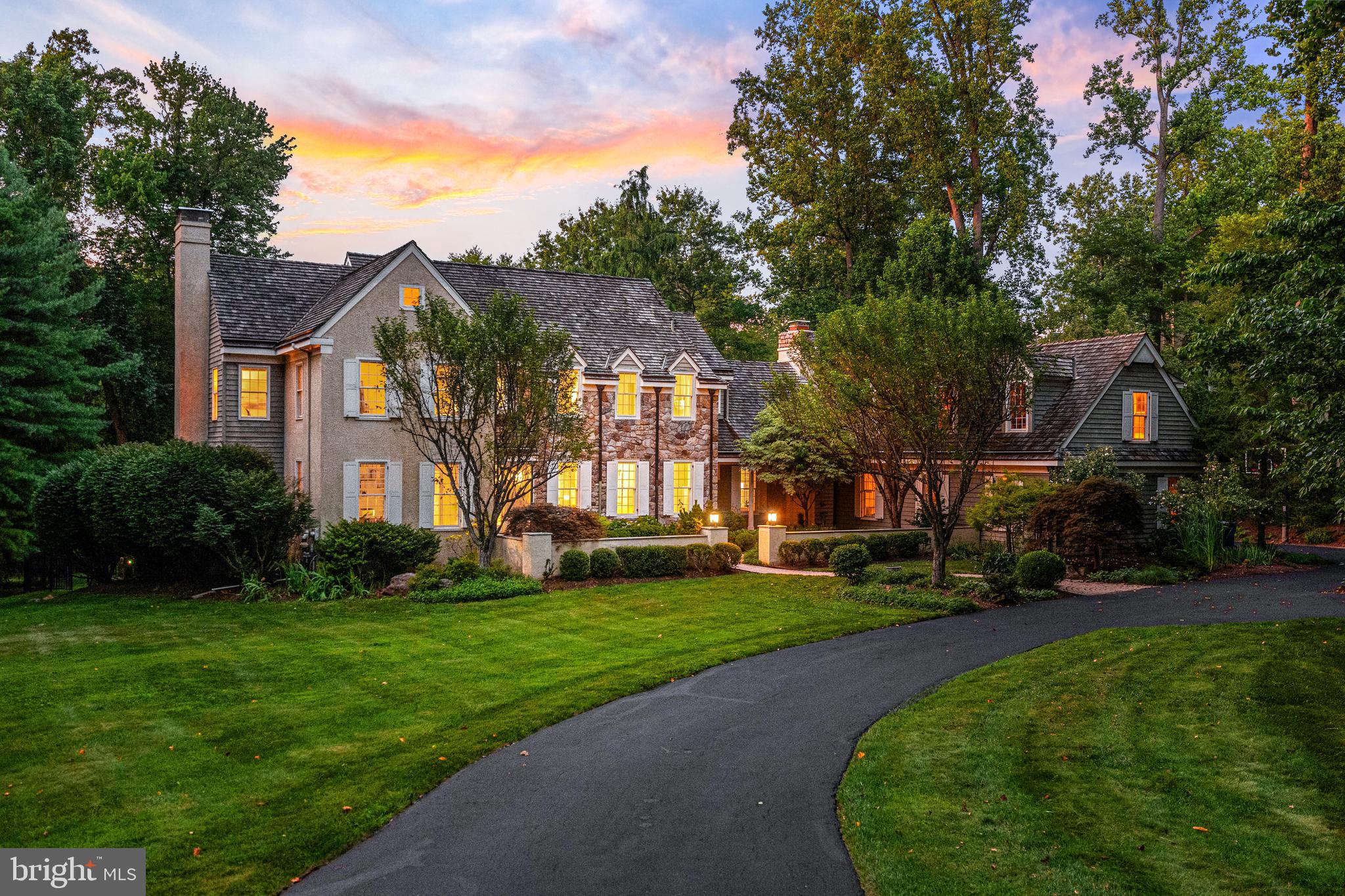 Welcome to 1285 Farm Road, a distinguished Pohlig-built resale on 1.3 private acres with a pool in the sought-after Leopard Farm enclave of Berwyn. Built in 1989 by one of the Main Line’s premier custom builders, this 6-bedroom, 4 full and 2 half bath residence includes a beautifully finished walkout lower level. Surrounded by mature trees and lush, year-round gardens—including specimen tree peonies at the front entry—it sits within the top-ranked Tredyffrin-Easttown School District.
Tucked into a sought after neighborhood of large lots, the property offers the perfect balance of privacy and convenience, with easy access to Rt 252, Leopard Rd, Sugartown Rd and nearby schools, shops, and dining. Set back from the road, the home is approached through a winding driveway with lots of privacy andparking and beautifully landscaped courtyard entry and surrounded by thoughtfully designed gardens. These outdoor elements set the tone for the gracious interiors that follow. Inside the home features light filled rooms, complemented by high ceilings, detailed millwork, and rich hardwood floors.
The classic center hall design features a welcoming foyer flanked by a sunlit dining room with a bowed window and a formal living room with fireplace and marble surround. The library/home office/den offers a peaceful retreat overlooking the expansive front lawn—ideal for working from home. At the heart of the home is the spacious, open-concept kitchen and great room. The kitchen includes a Sub-Zero refrigerator, stainless steel appliances, large center island, peninsula seating,  walk-in pantry, and built-in desk surrounded by custom cabinetry. A butler’s pantry connects to the dining room, and the adjacent breakfast room opens to the rear deck via French doors. The great room features vaulted ceilings,  dramatic floor-to-ceiling stone fireplace, and a wall of windows overlooking the backyard and French doors that open to the deck. These three spaces—kitchen, breakfast room, great room—flow effortlessly together for a layout that invites connection and comfort. Backstairs are located here. The main level also includes a mudroom, two powder rooms, and a large laundry room with granite counters and cabinetry.
Upstairs, the primary suite is a private retreat with two walk-in closets, and a large spa-style bath featuring double vanities, a soaking tub, and a separate shower. Bedroom 2 enjoys an en-suite bath, while Bedrooms 3 and 4 share a well-appointed Jack-and-Jill bath with dual vanities. A bonus room right next to the primary suite with a soaring ceiling and built-in sink offers flexible space—used as an art studio, this could be a 5th upstairs bedroom. 
The finished walkout lower level includes an additional bedroom, full bath, gym area, and a media/bonus room. A built-in bar w/ granite counters, wine refrigerator, and a stone feature wall makes it ideal for entertaining, while a separate area is perfect for ping pong, movie nights,  or sleepovers. It also provides direct walk-out access to the pool. Large windows, recessed lighting, and a mix of tile and carpeted flooring bring comfort and flexibility to this well-designed level.
From the mudroom door, through a charming breezeway, enter the oversized 3-car garage with stairs to a large unfinished space above, ideal for creating another living suite, an office, home gym or studio.
Outdoor living is equally impressive: a multi-tiered deck, tiled patio, mature landscaping, and shaded areas surround the in-ground pool and spa, creating a peaceful oasis.
Located in award-winning T/E Schools - minutes to Beaumont Elementary, Episcopal Academy, and Paoli Train Station (with service to NYC and Center City Phila.), this home also provides easy access to Route 30, 252, and 202, and is convenient to shopping and dining in Berwyn, Paoli, Devon, Newtown Sq and more.
1285 Farm Road, Berwyn offers a serene setting, timeless design, and exceptional livability—all in the heart of the Main Line.