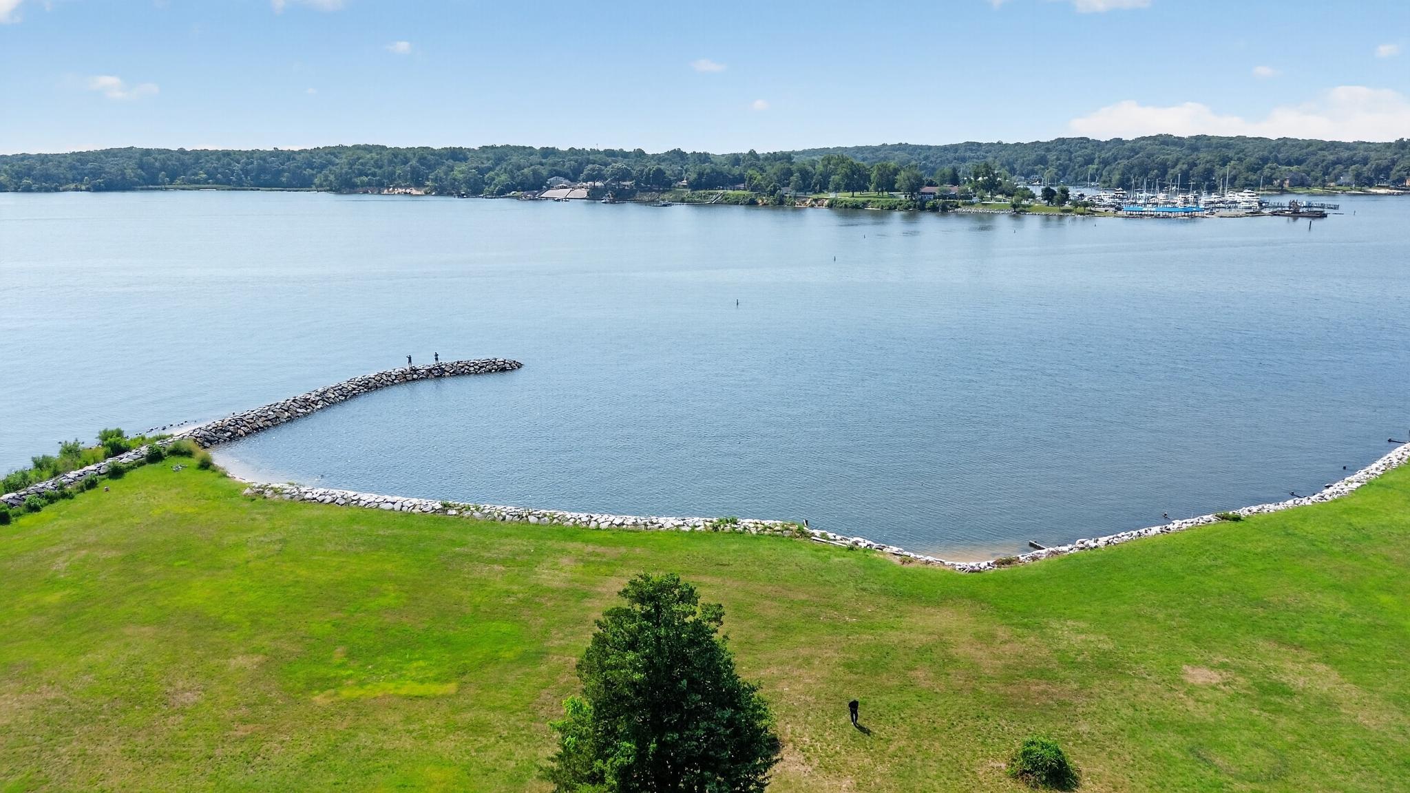 Water views & waterfront living, WITHOUT the WATERFRONT price tag! Non-Riparian Waterfront Living at its Finest! Welcome to this beautifully updated 5-bedroom, 3-bath home nestled along scenic Rock Creek, where you can enjoy the boating lifestyle without paying premium waterfront prices. Take in peaceful water views from your expansive deck, relax in your private hot tub, or launch your boat from the nearby community boat ramp and pier for a day on the water. Located just minutes from Mike's North Restaurant and the Maryland Yacht Club, you'll have convenient access to waterfront dining, entertainment, and even nearby boat fuel. Inside, you'll find a spacious layout with room for everyone, featuring a beautifully UPDATED Kitchen w/GAS COOKING, RENOVATED BATHROOMS, and a FINISHED LOWER LEVEL that's perfect for entertaining or multigenerational living. Pride of ownership shines throughout with an impressive list of recent improvements, including a NEW ROOF, NEW WINDOWS, NEW HVAC System, Expansive Deck, Retractable Awning, NEW Pellet Stove insert with beautiful Stacked Stone Surround, NEW Wrought Iron Fence, NEW Front Door, NEWER Retaining Wall, UPGRADED ELECTRICAL, and so much more. Whether you're searching for more space, modern updates, or the perfect place to enjoy the Chesapeake Bay lifestyle, this home offers the ideal combination of comfort, convenience, and value. Don't miss your opportunity to enjoy WATERFRONT LIVING without the waterfront price! BUY THIS HOME WITH NO INCOME VERIFICATION!
