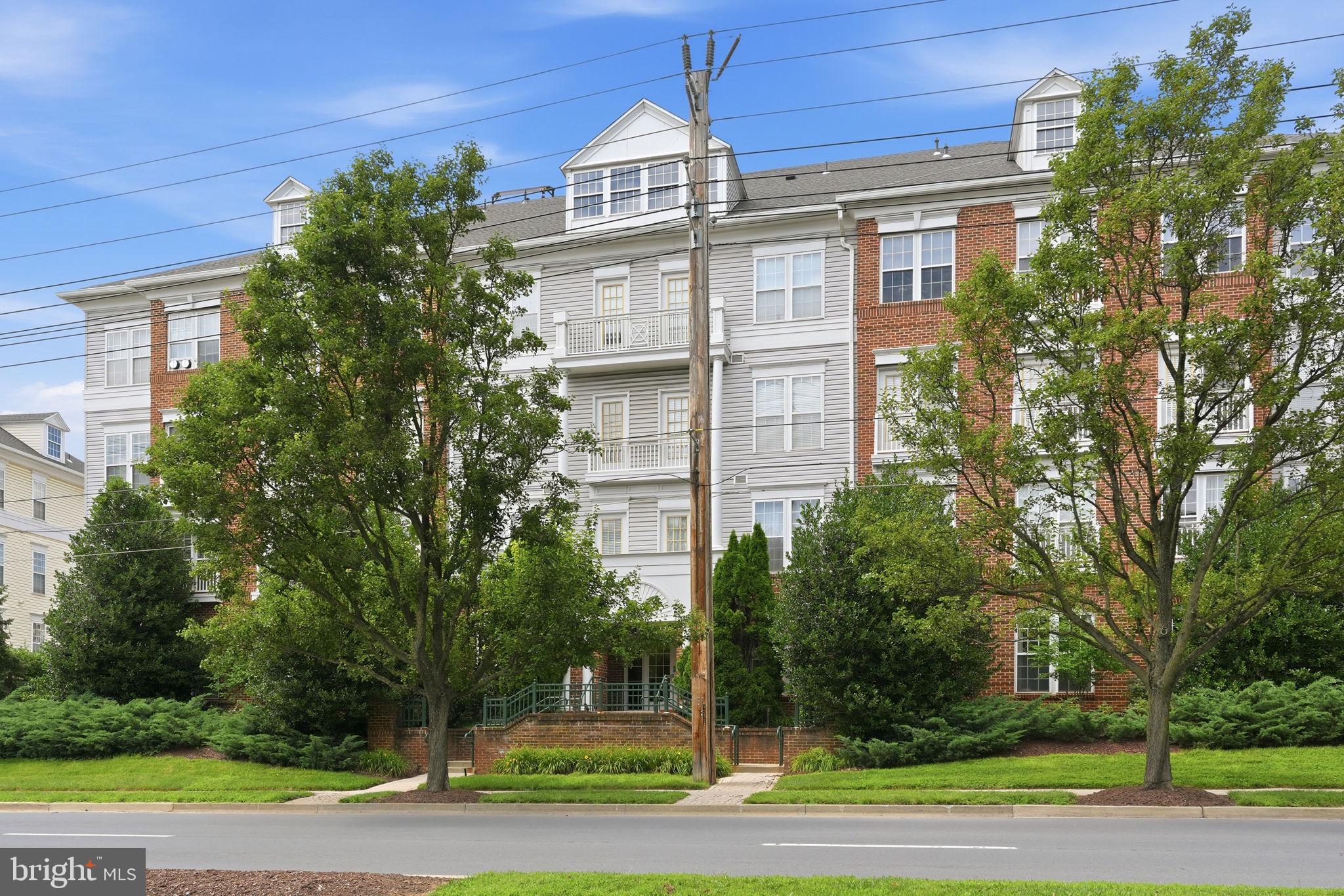 MOVE-IN READY! Welcome home to this spacious 1,582-square-foot condominium in the highly sought-after King Farm Village! This beautifully updated 2-bedroom, 2-full-bath residence includes a private attached garage parking space with an additional parking space directly behind the garage door.

Freshly painted throughout, the home features luxury vinyl plank flooring, oversized windows that fill the space with natural light, and an open, inviting floor plan. The expansive kitchen boasts a large center island, abundant cabinet and counter space, and high-end stainless steel appliances (approximately 2 years old), including a gas range, French-door refrigerator, built-in microwave, and dishwasher—making it ideal for everyday living and entertaining.

The spacious primary suite offers a fully renovated luxury bath with a double vanity, an oversized walk-in shower, and custom walk-in closets. A generously sized second bedroom and full bath provide ideal accommodations for guests or a home office. The separate laundry room includes a full-size washer and dryer for added convenience.

Located in a quiet elevator building, you'll enjoy the convenience of being just steps from King Farm Village Center's shops, restaurants, and everyday amenities. Community amenities include pools, parks, walking trails, tennis courts, playgrounds, and a complimentary shuttle to the Shady Grove Metro. With quick access to I-270 and the ICC, commuting is effortless.

GREAT UNIT... GREAT LOCATION... GREAT VALUE! HURRY—THIS WON'T LAST LONG!