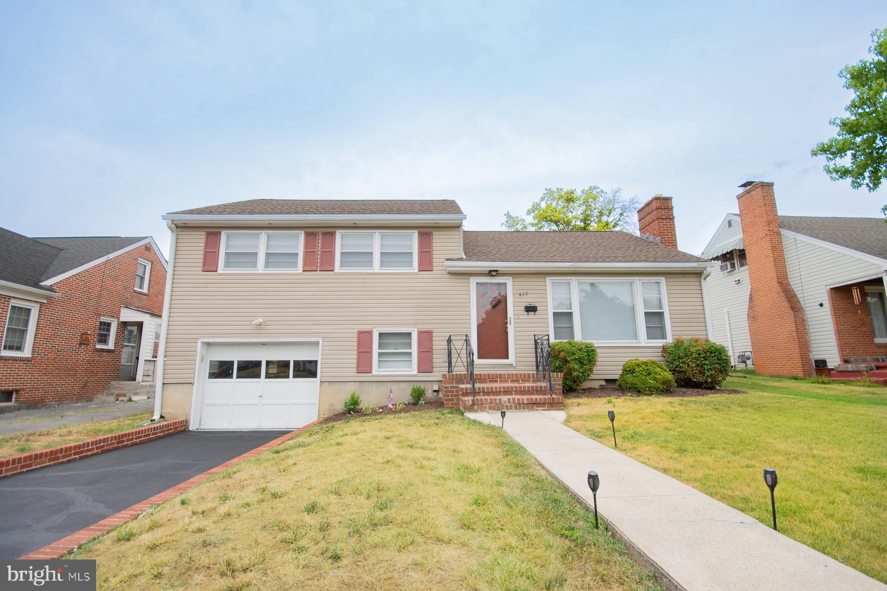 Charming Tri-level Home in the Desirable West End of Martinsburg. 
Welcome to this beautifully maintained trilevel home, situated in the highly sought-after West End of Martinsburg. Built in 1955, this timeless residence has undergone meticulous care and updates, making it the perfect offering for today's market. The newer HVAC and roof take away maintenance concerns. Upon entering, you will be greeted by a fresh and inviting ambiance, with new paint and polished floors that exude a warm and welcoming atmosphere. 

The living room features a cozy wood-burning fireplace, complemented by large windows that allow abundant natural light to fill the space. Ceiling fans ensure optimal comfort, while a patio offers a serene outdoor retreat. 

The upper floor boasts three immaculate bedrooms, each thoughtfully designed with your utmost comfort in mind. Adjacent is a full bathroom, providing convenience and functionality for your daily needs. The main floor encompasses a spacious living room, a dining room, and a delightful kitchen. 

The kitchen exudes charm with its new appliances and vintage metal cabinets, perfectly in sync with the character of the house. This culinary haven will inspire your inner chef and create lasting memories with family and friends. 

The lower level offers a versatile space, featuring a full bathroom and a generously sized rec room. The attached one-car garage has been meticulously presented with fresh paint and a newly painted floor, ensuring both functionality and style. 

Situated in an amazing neighborhood, this home is sure to capture attention. Its location offers a plethora of amenities and conveniences, making it an ideal place to call home. Don't miss this opportunity to own a piece of Martinsburg's history with all the modern comforts. Schedule a viewing today and experience the charm and allure of this remarkable property.