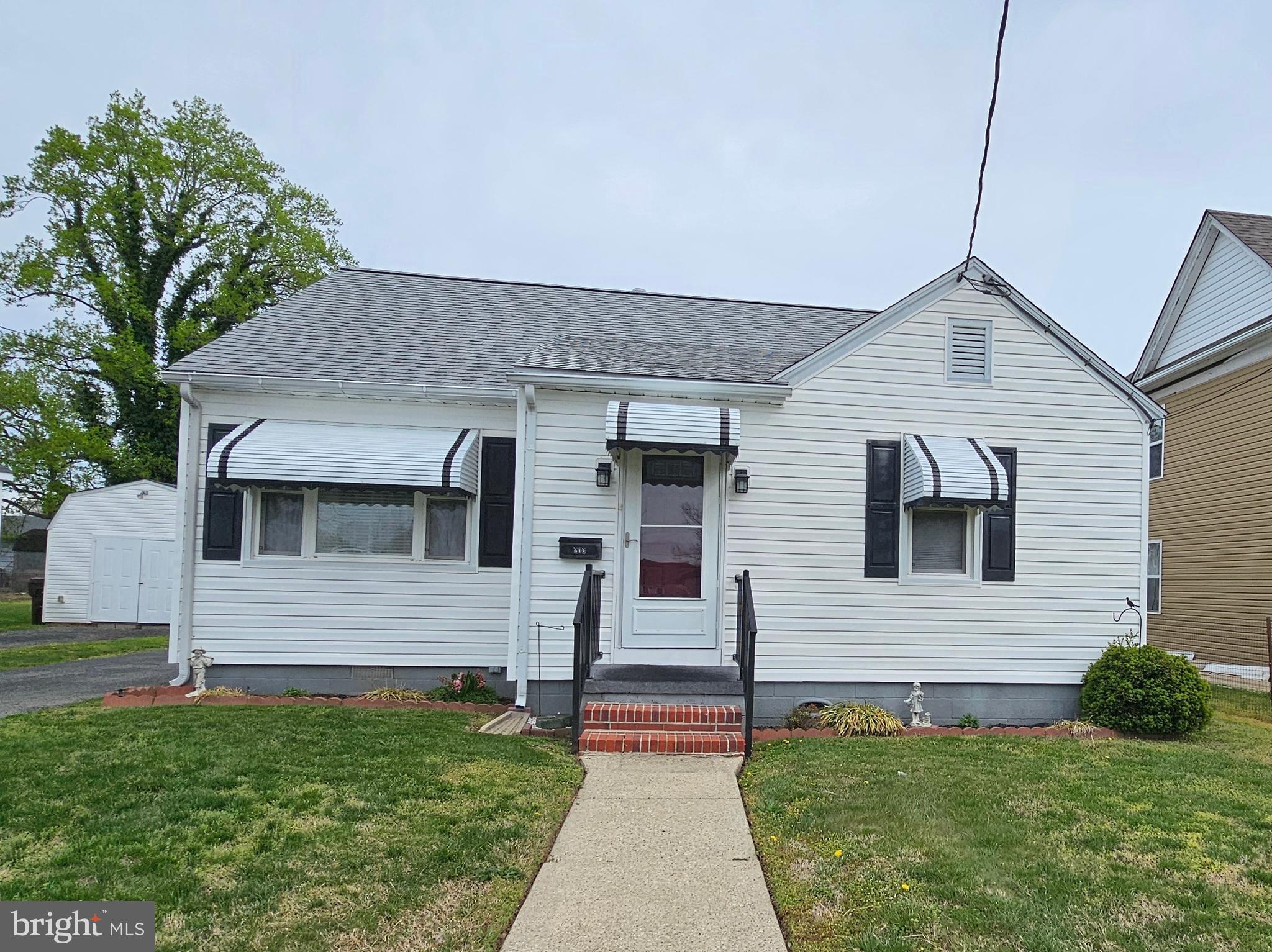 Adorable Bungalow with Timeless Charm in Historic Waterfront Town - 
Step into this adorable bungalow that’s neat as a pin and full of old-time charm! With two cozy bedrooms and one bath, this delightful home offers the perfect blend of character and comfort. The kitchen is outfitted with plenty of cabinets, and the laundry room is equally impressive. Hardwood floors lie beneath the carpet, just waiting to be restored to their original beauty. Convenient pull-down stairs lead to a finished attic with windows at both ends. Natural gas heating paired with central A/C ensures year-round comfort. Outside, the backyard features a detached garage complete with a covered side porch, along with an extra shed for additional storage.
Nestled in a scenic waterfront town rich in history and coastal beauty, you’ll love the relaxed pace, friendly atmosphere, and endless opportunities for exploring local shops, dining, and shoreline strolls. Whether you're looking for a peaceful getaway or a charming full-time residence, this gem is a must-see!