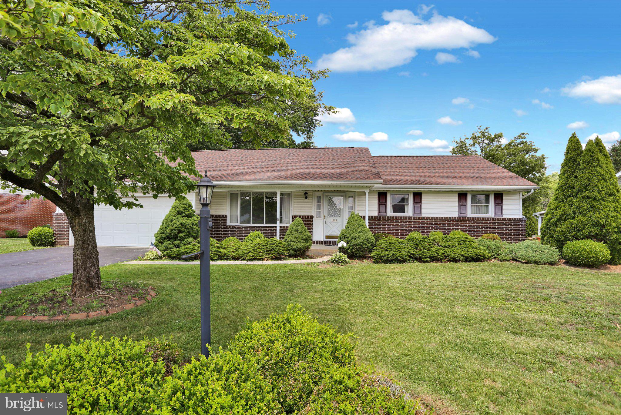 Welcome to this newly updated well-maintained ranch home in the desirable Wilson School District. This home features gorgeous hardwood oak flooring in the living room and the three bedrooms as well as all new luxury vinyl plank flooring in the kitchen and dining rooms.  All bathrooms have been updated with new flooring. The home offers one-floor living, including a comfortable layout with spacious living and dining areas that are perfect for everyday living and entertaining. The highlight of the home is the wonderful sunroom, filled with natural light and offering a relaxing space to enjoy morning coffee, read, or take in views of the backyard. The kitchen provides ample cabinet and workspace, while the bedrooms offer comfortable retreats with good closet space. Additional finished living space in the lower level provides flexibility for a family room, home office, or hobby area and features all new tile flooring.  If that wasn't enough to get you excited, this house also features and attached two car garage.  This home is situated on a nicely sized lot in an established neighborhood, the property offers room to relax, garden, or entertain outdoors. Conveniently located near shopping, dining, parks, and major commuter routes, this home combines easy living, a great location, and the comfort of single-floor convenience.