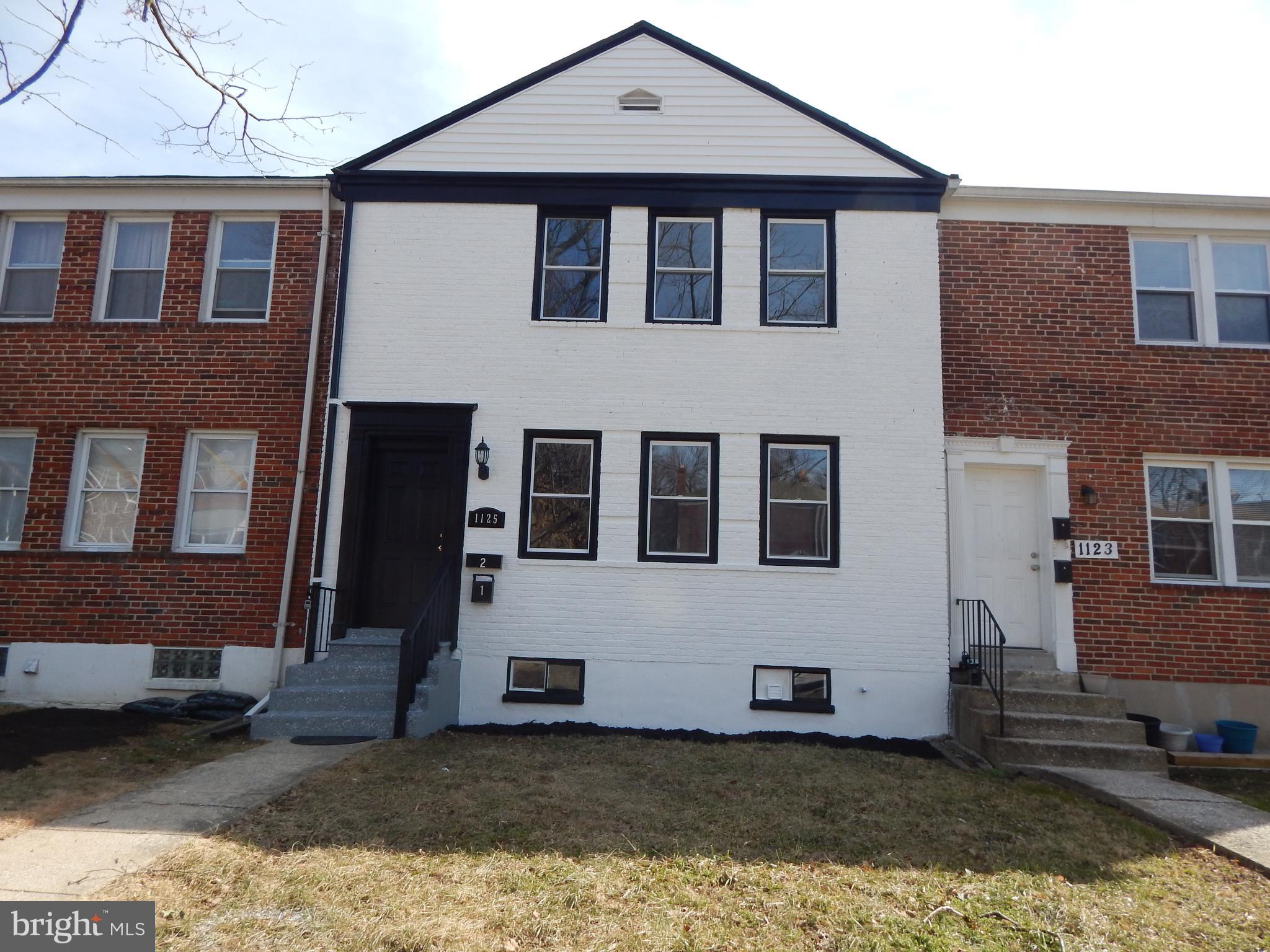 This wonderfully renovated home provides ample room for comfortable living for two families.  This 2 unit home features 2 bedrooms and 1 full custom tiled bathroom in each unit.  Each Unit's kitchen boasts stainless steel appliances, granite counters and an eat-in 2-4 person kitchen Island and plenty of cabinet space. You will notice custom details throughout each unit  with craft-man style wainscoting, luxury vinyl flooring, and recessed lights. Enjoy the warmth and beauty of your brand-new electric fireplace with custom lights and flames in your big open living room/dining room. This 2 unit  home has been completely updated.  Huge bonus is the shared basement with Washers and Dryers and plenty of storage for each unit.  Step out the backdoor and onto your huge, lighted custom deck.  Perfect for entertaining or relaxing in the sun with a cup of coffee in the morning or watching the sunset with cocktails in the evening. 1 Year roof certification, as well. Home located just minutes from Northern Parkway and  I83.  Given its desirable location, recent renovations, and numerous amenities, this home is priced to sell quickly. Once you visit, you will call it HOME.  You can rent out one unit and live in the other.  A great way for someone else to help pay for your mortgage!  Ask about Seller help with closing costs.