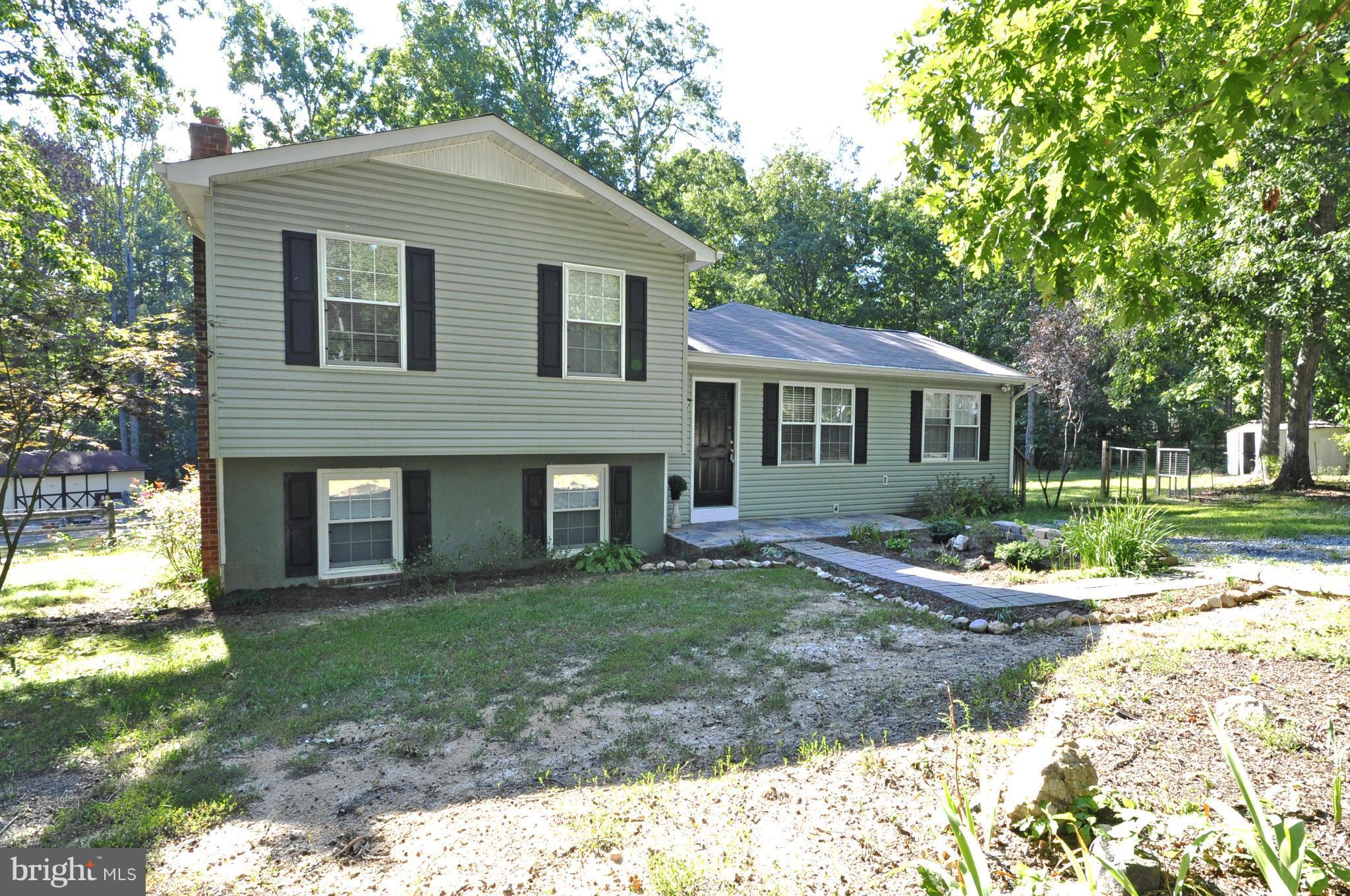 Cute as a button updated Bi-Level on 1.13 acres.  Interior offers main level master suite with large W/I closet w/custom shelves, full bath including jetted tub and ceramic, additional room can be baby room/den/library or office. Kitchen w/bar area, marble, stainless and custom ceramic backsplash.Lower level rec.room w/half bath. Four doors exit to outside w/partial fence and shed.