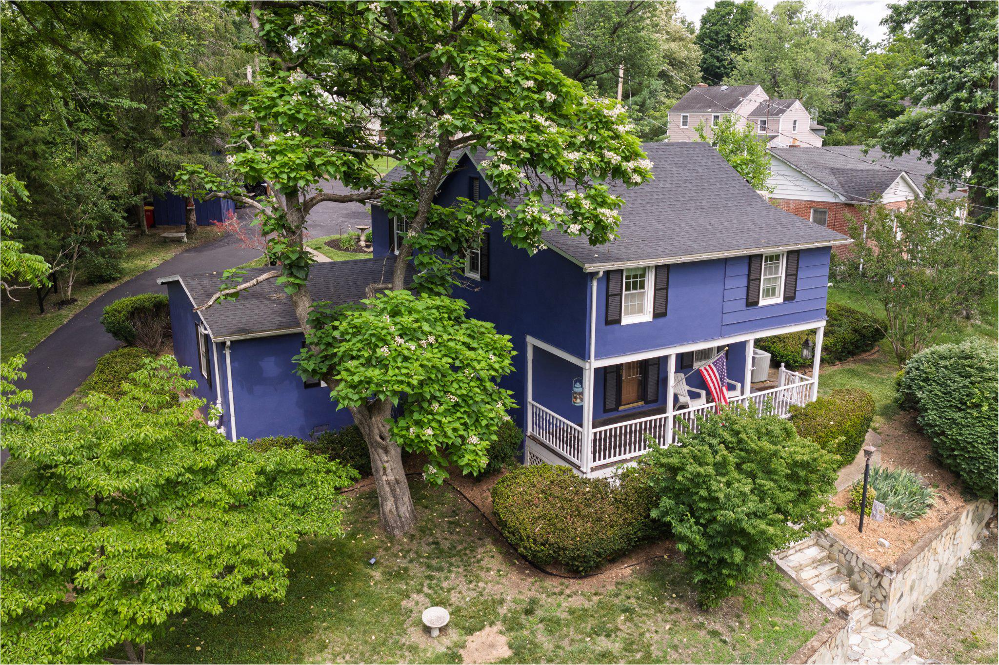 This charming Colonial home, built in 1851, offers a perfect blend of historic character and modern comfort. Offering 4 bedrooms and 2 bathrooms with a total of 2,322 square feet.  Step inside to discover an open floor plan, a first-floor bedroom and bathroom, a large laundry/mud room, a dining room, and beautiful hardwood floors that create a warm comfortable atmosphere. The country-style kitchen features upgraded countertops and stainless-steel appliances, making meal prep a delight. Cozy up by the brick fireplace, perfect for winter evenings. The 2nd floor has 3 bedrooms and 1 bath, as well as a large walk-in closet and a linen closet.  The exterior boasts lovely landscaping and stone retaining walls, enhancing the home's curb appeal. Relax on the large front porch, overlooking the beautiful grounds of Happy Retreat (Charles Washington's home).  Or sit and enjoy your glass-enclosed stone back porch and watch the birds in your back yard.   The spacious lot adjoins open space next door, providing a serene backdrop to watch the deer and turkeys walk by.  Additional structures include a shed for lawn tools and a workshop for hobbies or mechanic work.  There are plenty of parking options, including a detached 2-car carport and enough driveway space for multiple vehicles, trailers, boat, etc.  This home is not just a place to live; it's a sanctuary waiting for you to create lasting memories.