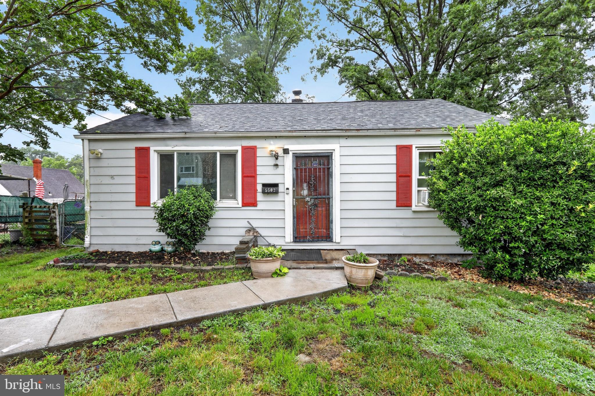 Charming cottage with walkout basement, yard space, and convenient access to major routes.
This two-bedroom, one-bath home presents a great opportunity to create your vision in a well-established neighborhood. A fenced front yard and landscaped walkway lead to the entrance, creating a welcoming approach with greenery and outdoor space. 
Inside, the living room features a fireplace that adds character and warmth, while natural light enhances the bedroom’s comfortable layout. The home includes a walkout lower level, offering additional flexibility for storage, workspace, or future finishing potential.
Both the front and backyard provide room for gardening, outdoor seating, or simply enjoying the surrounding trees and natural setting. Mature landscaping and green space create a peaceful atmosphere while still being close to everyday conveniences.
Conveniently located near Annapolis Road, Kenilworth Avenue, and Route 450, the home offers easy access for commuting to Washington, DC, and the surrounding areas. Nearby Bladensburg Waterfront Park, local playgrounds, and neighborhood green spaces provide opportunities for outdoor activities, while shopping, dining, and daily essentials are just minutes away. 
This property offers potential, location, and outdoor space ready for your personal touch.
The photos have been virtually edited for clarity, including removal of personal property, to help showcase the home.  Thank you for understanding.