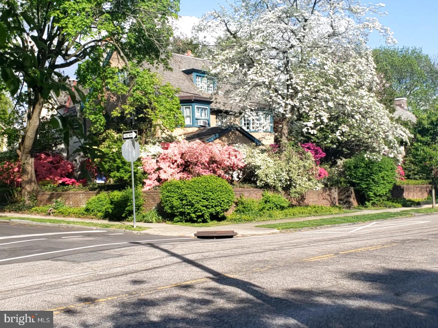 Welcome to this exceptional 1929 Cotswold Cottage with Sunny Southern Exposure located on a most desirable tree-lined street in East Falls! 
This home radiates warmth, character, craftsmanship and offers endless possibilities for the next lucky owners to revamp and modify.
Classic 1929 Corner twin property features 5 Bedrooms, 2 Full Baths, 3 Fireplaces (1 Decorative) designed with the classic Front and Back Staircase in the heart of historic East Falls located off Kelly Drive. Live among Philadelphia’s storied past, designed by distinguished architect, Lawrence Visscher Boyd in 1911, this was his personal home and has been lovingly cared for by the same family for 36 years. 

Main floor welcomes you to a 3-Season Glass enclosed Brick-paved Patio with wall-to-wall windows; a lovely room to curl up with a book and enjoy the Azaleas, Rhododendron, Roses and established mature perennials. Entry Foyer opens to gracious Living Room with wall of Curved Glass Windows, the focal point is the Wood-burning Fireplace with the distinguished Mercer Tile surround, Built-Ins Bookcases, architectural Crown Molding and original hardwood floors add warmth and character. Adjoining Dining Room boasts expansive Bay Windows, architectural Crown Molding & double French Doors creating a well-designed space for entertaining.
Eat-in Kitchen has generous cabinetry and counter space to enhance both functionality & storage with Bosch Dish Washer, 4-burner Gas Range. Breakfast area overlooks private Patio ideal for Gas-grilling and relaxing in a rare urban oasis with charming gardens, mature perennial shrubs to enjoy Wildlife sightings of Owls, Red Fox, Deer and Songbirds. A tucked staircase leads directly from the kitchen to the upper floors.

2nd floor has 2 Bedrooms and a Full Bath, including a spacious Primary Suite & large Walk-in Closet, 2nd Bedroom has built-in Day Bed, generous closets and wood-burning Fireplace. 3rd Bedroom with deep closet & large Bay Window complete this level. 3rd floor has Two additional Bedrooms, decorative Fireplace, an open landing Sitting Room with great natural light, Full Bath, and Kitchenette; ideal for guests, Nanny or In-Law Suite. The expansive basement offers excellent storage or creative workshop and includes exterior walk-out access. 

This gracious home offers timeless character, exceptional space, and unbeatable convenience in one of Philadelphia’s most sought-after neighborhoods, just off Kelly Drive, walk to McMichael park, Wissahickon & Schuylkill River Trails; perfect for biking, running, walking trails, Collegiate Sculling, watching the Dad Vail Regatta AND an amazing sledding hill - fun for kids and adults! 
Retail stores, fabulous local Restaurants, Cafes, Coffee Shop and Florists. Enjoy the Saturday farmer’s market, vibrant community events, Community Theater and live music at The Fallser Club. Effortless commute to the Suburban and Amtrak station just 10 minutes away.

Experience the convenience of city life with the charm of green space and a lovely neighborhood feel with quick access to Fairmount Park, Center City, University City, Chestnut Hill and the Main Line, as well as local hospitals and universities. East Falls delivers the convenience of city living with the peaceful feel of a tucked-away suburban Cotswold Cottage.