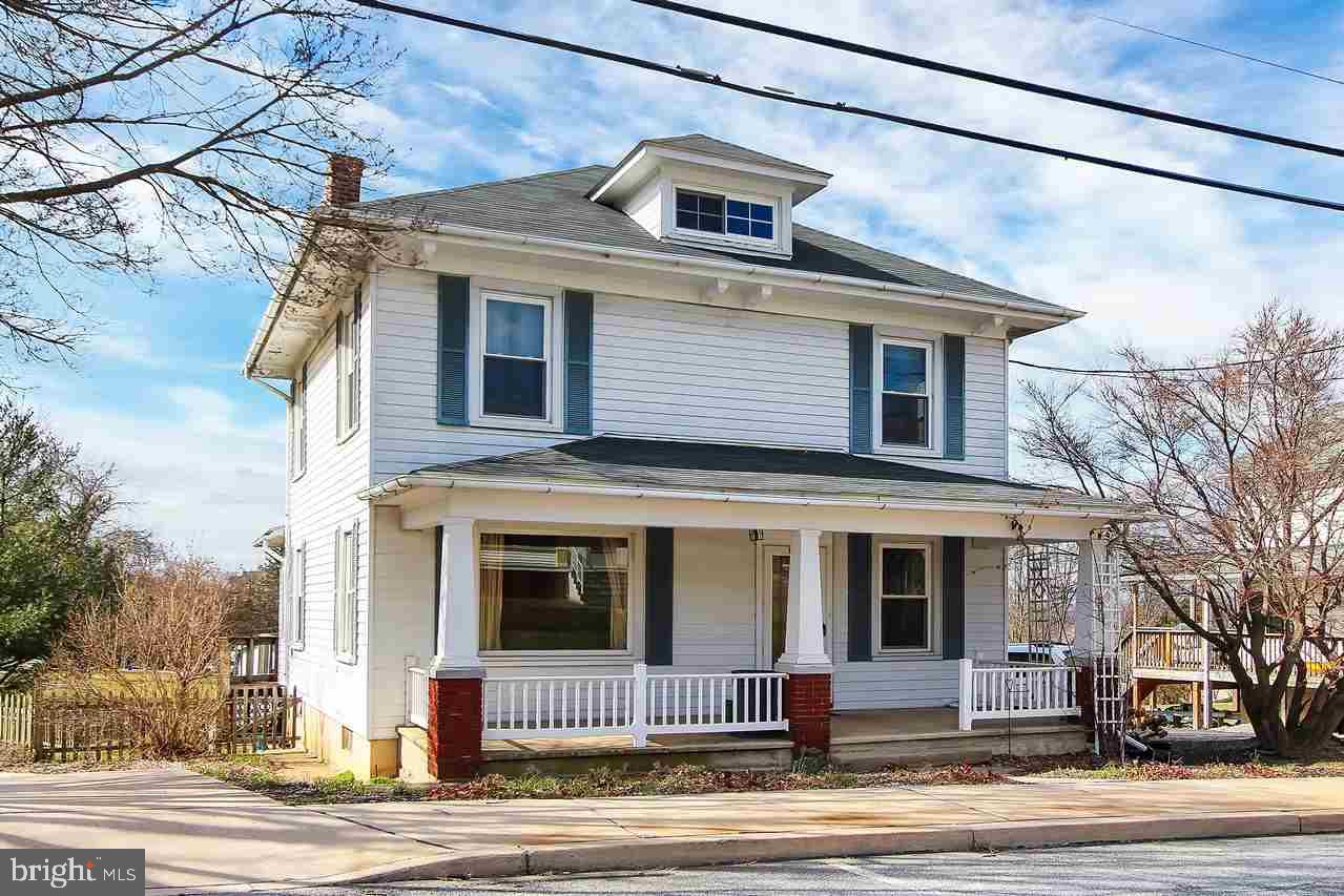 Comfortable and cozy describes this 2 story Colonial style home featuring 4 bedrooms, an updated kitchen plus all the appliances stay, plenty of natural woodwork and exposed hardwood floors throughout, a fireplace is in the living room, a covered front porch, and a large deck of the kitchen area, along with an inviting sunroom. All the bedrooms are generous in size with plenty of closet space. Also a full basement for additional storage.