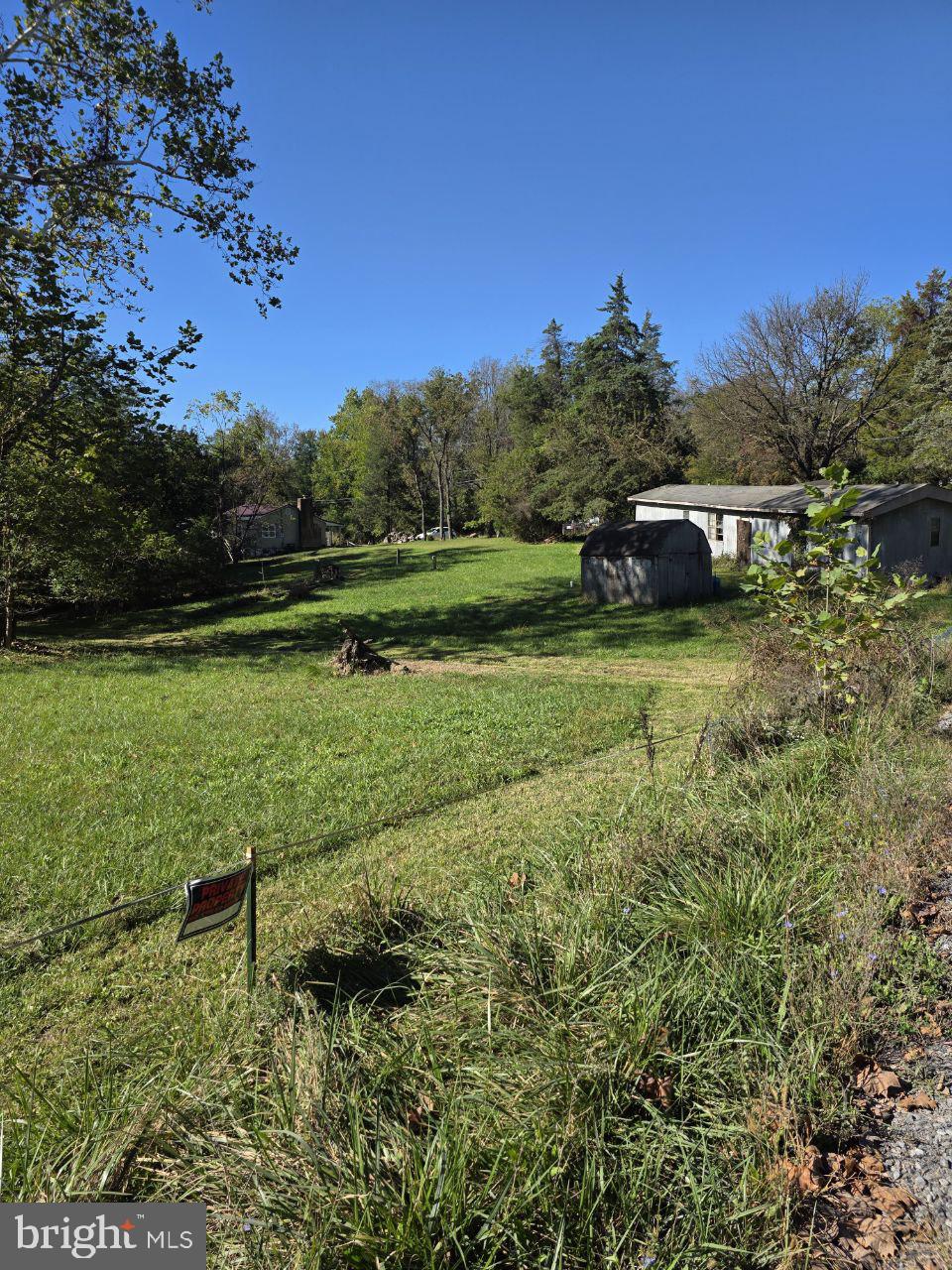 Two parcels (0.28 acres and 0.43 acres) sold together. Each lot is buildable. The land is flat, clean, and ready for construction. An old mobile home remains on the property and will need to be removed. The existing septic system and well may still be usable. Located in a quiet neighborhood near the Shenandoah River and just minutes from major state routes.