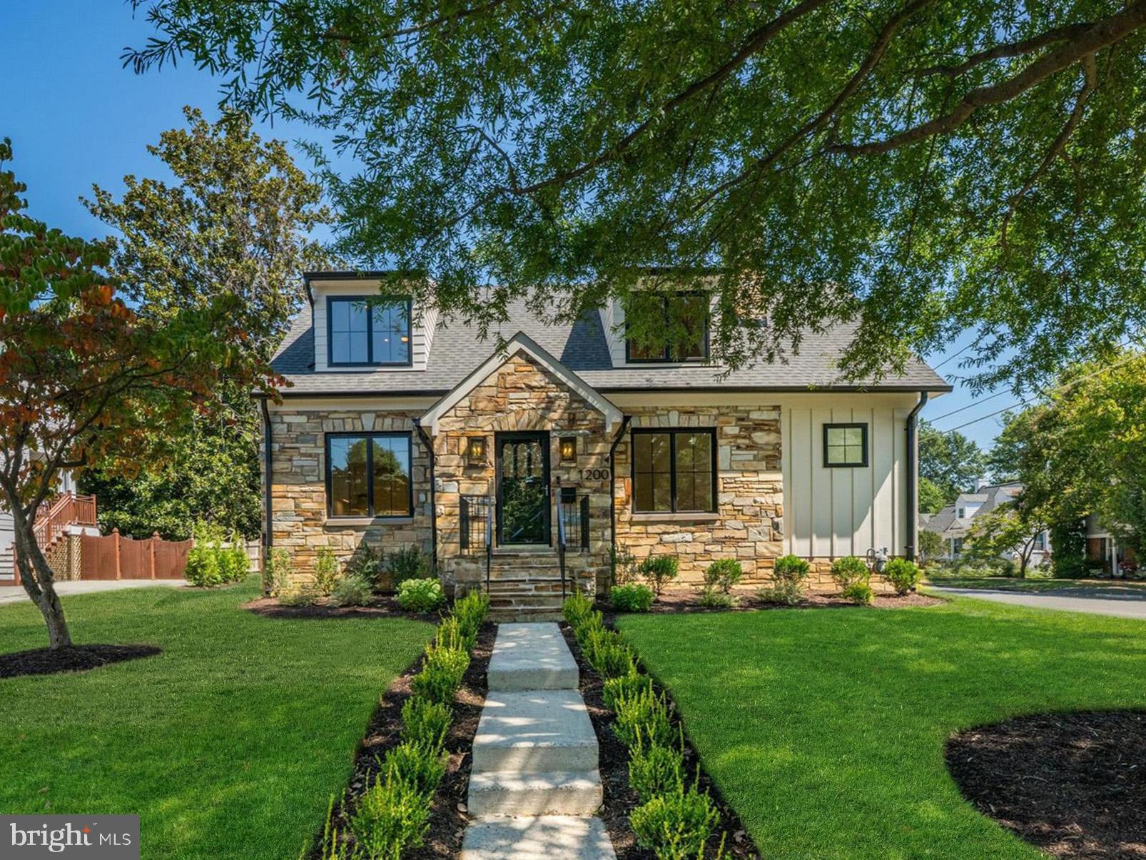 Unique opportunity to own a storybook stone residence, completely reimagined and expanded by the esteemed Falls Church City builder Randhawa Construction. This 4 bed/4 bath home seamlessly blends the enduring charm of its near-century-old stone exterior with the sophistication and convenience of new construction. The result is a home that reads as a top-to-bottom rebuild where no expense was spared, offering the craftsmanship, design, and finishes found in today’s most sought-after luxury homes.

The main level’s open-concept floor plan is ideal for modern living. Hand-laid oak hardwood floors, custom built-ins, and architectural details showcase the thoughtful craftsmanship throughout, while original features such as the stone fireplace and preserved vintage brass mortise door hardware add authentic period character. Newly enlarged, high-performance windows bathe the interiors in sunlight and capture picturesque views in every season.

The chef’s kitchen is a true showpiece, featuring slim-frame custom cabinetry, a quartz waterfall island designed to accommodate bar seating, and a full suite of Wolf/Sub-Zero appliances.  Perfect for entertaining, the kitchen flows directly into the expansive family room with its own wet bar, adjacent full bath, and convenient laundry.

Upstairs, the primary suite serves as a private retreat with a custom walk-in closet and a spa-inspired bath boasting heated floors, an oversized glass-enclosed shower with premium fixtures, and a private water closet. Secondary bedrooms feature cathedral ceilings, integrated dressers nestled under the eaves, custom closets, and oversized dormer windows overlooking a majestic willow oak.

The lower level offers flexible living with a guest/in-law suite or recreation room, complete with full bath, second laundry, storage, and a spacious mudroom with custom-built cubbies adjacent to the two-car garage.

Outdoor living is equally impressive, with an expansive screened patio overlooking the professionally landscaped yard—perfect for dining, lounging, entertaining or outdoor play.

Located in the heart of Falls Church City, this home offers unmatched convenience: walk or bike to the West Falls Church Metro (0.6 miles), shops, restaurants and movie theater (0.3 miles), the W&OD Trail (0.2 miles), High Point pool (0.3 miles), and the weekly farmers market, community center, and library (0.7 miles). Beloved for its small-town feel, sought-after Falls Church City is a close-knit community celebrated for its neighborhood events, fantastic local dining, and top-rated schools.  

Main image is architectural rendering (some details may vary).  Please see documents for architect’s renovation elevations, site plan, floor plan and builder home specs.  (Note: Adjacent lots 23 & 24 are owned by the seller and also available for purchase, offering potential for expansion—whether a detached structure, ADU, or pool.) Seller is a licensed real estate agent in VA.