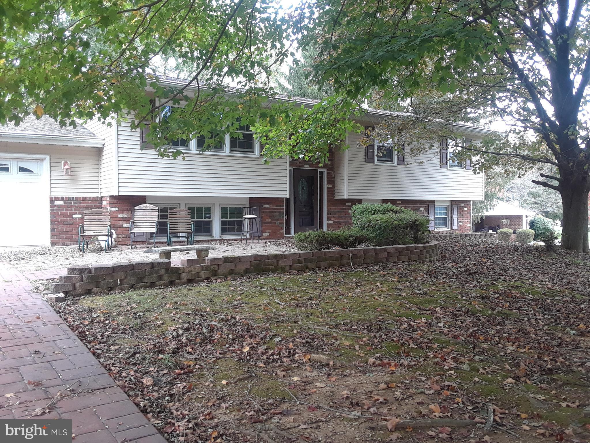 Lets look at the benefits- Wonderful location, location, location  on peaceful street, large room sizes, wonderful schools, huge attached garage, lower level family room with freestanding fireplace, walkout to patio, furnace just a few years old, newer water heater, deck, fenced yard area.   Pretty nice lot extends beyond the back fence. This home just needs your imagination to bring it back to the showplace it once was. Paint would go a long way, but take a look to build your "to do" list .  Priced to reflect the needed updates.