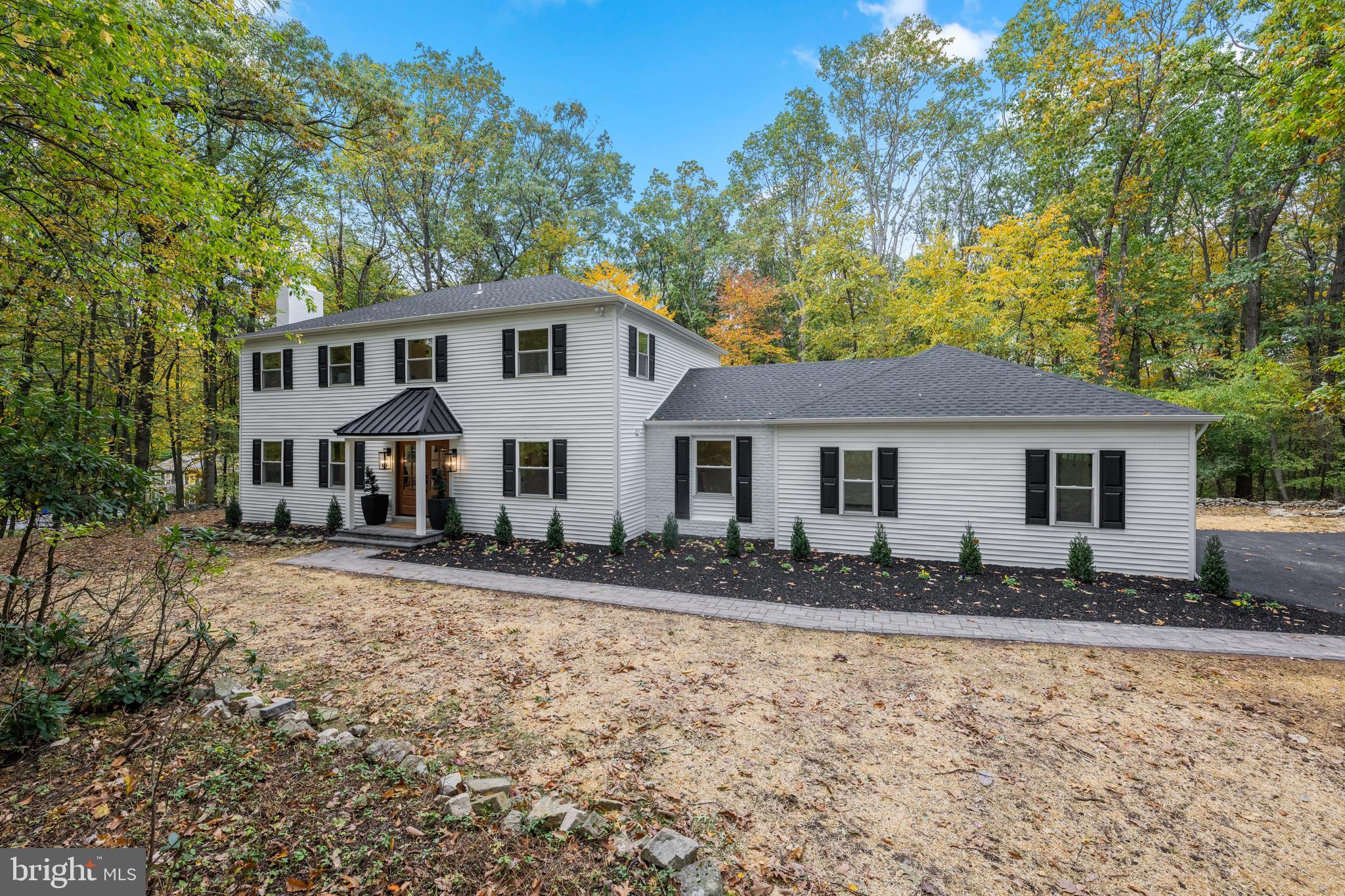 Brand New Complete and Total Renovation in Malvern!  
Virtually New Construction with New Roof, Siding, Windows, HVAC, Plumbing, Electric, Insulation, Drywall and All Interior Finishes.  One-Year Builder Warranty Provided. 

3053 Sidley Hill Road boasts a secluded private feeling on a quiet tree-lined street. Situated on just over 3 acres, this one-of-a-kind completely renovated home features 4 bedrooms, 3.5 bathrooms with  3,500 sqft of custom designed, modern living. Showcasing unparalleled design, this home is accented with high-end finishes throughout - White Oak Hardwood Floors, Kohler Fixtures, GE Cafe Appliances in Matte Black with Brushed Bronze Hardware, California Closets Built-Ins, Shiplap Accents and Custom-Designed White Shaker Kitchen Cabinetry.

The expansive open floor plan showcases the epitome of modern living with an oversized living area flooded with natural light illuminating from all new energy efficient windows. The living room features a gas fireplace with Shiplap Accent and Custom Mantle. The open floor plan seamlessly integrates the perfect indoor and outdoor flow, overlooking a flat backyard, creating an ideal ambiance for family living and entertaining. Gourmet kitchen outfitted with custom Cabinetry, GE Cafe appliance suite, expansive Quartz center island with waterfall edge and elegant marble backsplash.  This is a true Chefs kitchen with a six burner gas range, flattop grill, and double oven!  Continuing on the first floor there is a massive walk-in pantry, half bath and a spacious mud room designed by California Closets is right off the two car garage and can be closed off from the living area.  A beautiful Laundry Room with plenty of cabinetry and space is located off the mudroom.  An elegant office space off the front door finishes off the first floor. 

Upstairs, the grand primary suite exudes a light and airy feeling with a vaulted ceiling, farmhouse chandelier and expansive windows overlooking the backyard and your 3 acres of wooded land. The primary walk-in closet is outfitted with a custom-made wardrobe by California Closets. The primary bathroom includes an expansive tiled shower with bench and rainfall head in matte black finish plumbing, with a dual-sink Quartz countertop custom vanity, and a soaking tub. The second level features three additional bedrooms, each with vaulted ceilings, California Closets installed, and two additional full baths. The Jack-n-Jill Bath features a large shower and dual-vanity. An additional full bathroom can be used as a hallway bath or en-suite to one of the bedrooms and features a bathtub oak wood vanity. The basement is fully finished and features upgraded Mohawk carpet, with an additional room that can function a toy space, basement speakeasy, or gym, plus two additional storage areas.

All new dual system HVAC, new plumbing, new electric, new roof, new siding, new plumbing, new recessed lighting and fixtures throughout, new flooring, new tile, etc. The house is a complete and total renovation and comes with a one-year builder warranty. The entrance is accented with a newly built portico with posts and metal roof, with flagstone pavers leading to the freshly blacktopped driveway.

Don't miss your chance to see this modern and all new home in person. Only 15 minutes to KOP and less than 10 minutes to local Great Valley Schools.