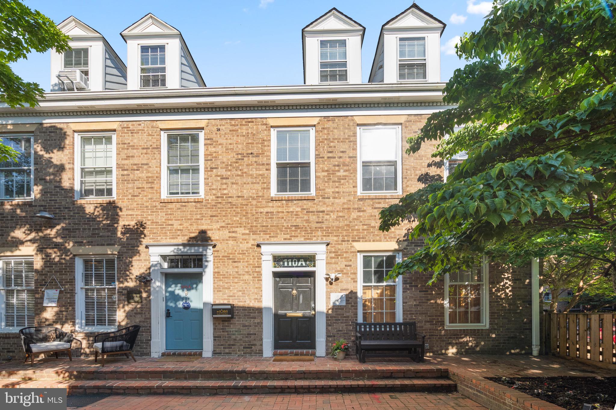 Welcome to Barrister Square! Tucked within a private courtyard just steps from vibrant King Street, this sun-drenched 4-level end-unit brick townhouse offers exceptional versatility in one of Old Town Alexandria’s most sought-after locations. Configured as two separate 2-level residences and currently operating as a popular short-term rental, this unique property presents an outstanding opportunity for owner-occupants, investors, or live/work buyers. MORE PHOTOS at Residential Listing VAAX2059284. 
Extensively renovated in 2022, the home features stylish modern finishes throughout, including updated baths with designer tile and fixtures, high-end lighting, in-unit Miele washer/dryers in both residences, separate HVAC systems and water heaters, hardwood floors across three levels, luxury vinyl plank flooring on the lower level, oversized windows, soaring ceilings, skylights, custom transoms, and a striking spiral staircase that adds architectural character and connects the upper residence to the loft level.
The upper residence features a full kitchen with island seating, granite countertops, spacious kitchen and dining area with soaring ceilings and skylights, a large bedroom with sitting area, main-level half bath, loft-level family room with built-ins, an oversized second bedroom beyond a custom sliding door, and a full bath with walk-in rain shower.
The main/lower residence offers two spacious bedrooms, including one with ensuite half bath, the other a Murphy bed, along with a full bath featuring a walk-in rain shower. The flexible lower level includes a kitchenette, built-in banquette dining area, fireplace lounge, separate flex space, second half bath, and laundry.
Outside, the charming, shared courtyard framed by mature trees and garden beds creates a peaceful retreat just moments from King Street’s acclaimed restaurants, boutiques, waterfront, Metro, commuter routes, and the free King Street Trolley.
Commercial Low zoning offers exceptional flexibility for residential, live/work, office, or rental use. An exceptional Old Town offering blending architectural character, flexibility, and investment potential in a premier location.
*Available furnished via separate arrangement with seller. Furnishings are personal property excluded from the real estate transaction.