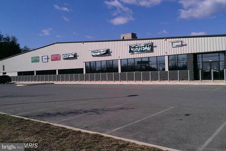 Property includes three parcels, over 11 acres,, to include 28,000 s/f Sports Complex, Liquor store , Motorcycle shop, and 4 residential rental units  a House, trailer home and two apartments and a Cell tower site lease.  Daily traffic count over 36,000 units daily. Direct road frontage on Route 2/4