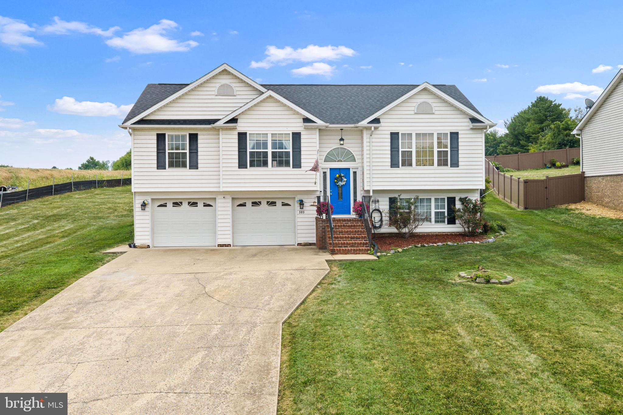 Located on the edge of town with beautiful mountain views, thoughtful updates, and a fully finished layout make this Woodstock home one you won't want to miss. One less worry for the new owner, the home will have  carpets professionally cleaned as well as the home. Offering 3 bedrooms with the potential for a 4th, 3 full baths, and an open-concept design with vaulted ceilings, this home combines comfort and functionality. Step through the kitchen's double doors onto the new deck, creating the perfect space for entertaining or relaxing while enjoying the surrounding scenery.

The spacious primary suite features a soaking tub, double vanity, and backyard view. The kitchen offers a large island with additional storage, a pantry, and plenty of room for a full-size dining table.

Recent updates include a new roof (2022), heat pump (2020), hot water heater (2026), garage repair (2026), and new deck (May 2026). Have peace of mind with the big ticket items already done for you. 
Laundry room has shelving and utility sink. 

You'll enjoy easy access to downtown Woodstock's restaurants, bakeries, breweries, floral shops, theatre and local boutiques. Outdoor enthusiasts will appreciate nearby hiking trails, fishing, tubing, kayaking, wineries, vineyards, and all that the Shenandoah Valley has to offer. Conveniently located near shopping, local markets, and the Shenandoah County Fairgrounds, home to the county fair, concerts, and year-round community events.