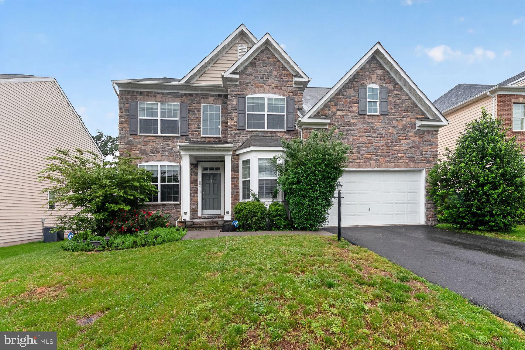 Nestled in the charming River Pointe community, this stunning Colonial-style home offers a perfect blend of comfort and modern living. Built in 2015 by K. Hovnanian, this spacious home offers over 3,700 square feet of thoughtfully designed living space featuring wide-plank hardwood floors, an open-concept layout, and elegant finishes throughout. The gourmet kitchen is the heart of the home, showcasing stainless steel appliances, upgraded countertops, double ovens, and an oversized island that flows seamlessly into the bright morning room and inviting family room with fireplace.
Upstairs, the luxurious owner’s suite impresses with cathedral ceilings, a private sitting area, and a spa-inspired bath, while three additional bedrooms provide ample space for family, guests, or home office needs. The finished walk-out lower level with full bath offers flexible living and entertaining space perfect for a recreation room, gym, or media area. Situated on a premium wooded homesite with a 2-car garage and access to exceptional community amenities including pool, clubhouse, tennis courts, and playgrounds, this home combines comfort, style, and convenience.
River Pointe is conveniently located near top-rated schools, parks, and essential public services, ensuring a vibrant lifestyle. Just minutes from historic downtown Leesburg, shopping, dining, and major commuter routes, this community truly embodies the essence of comfortable living.