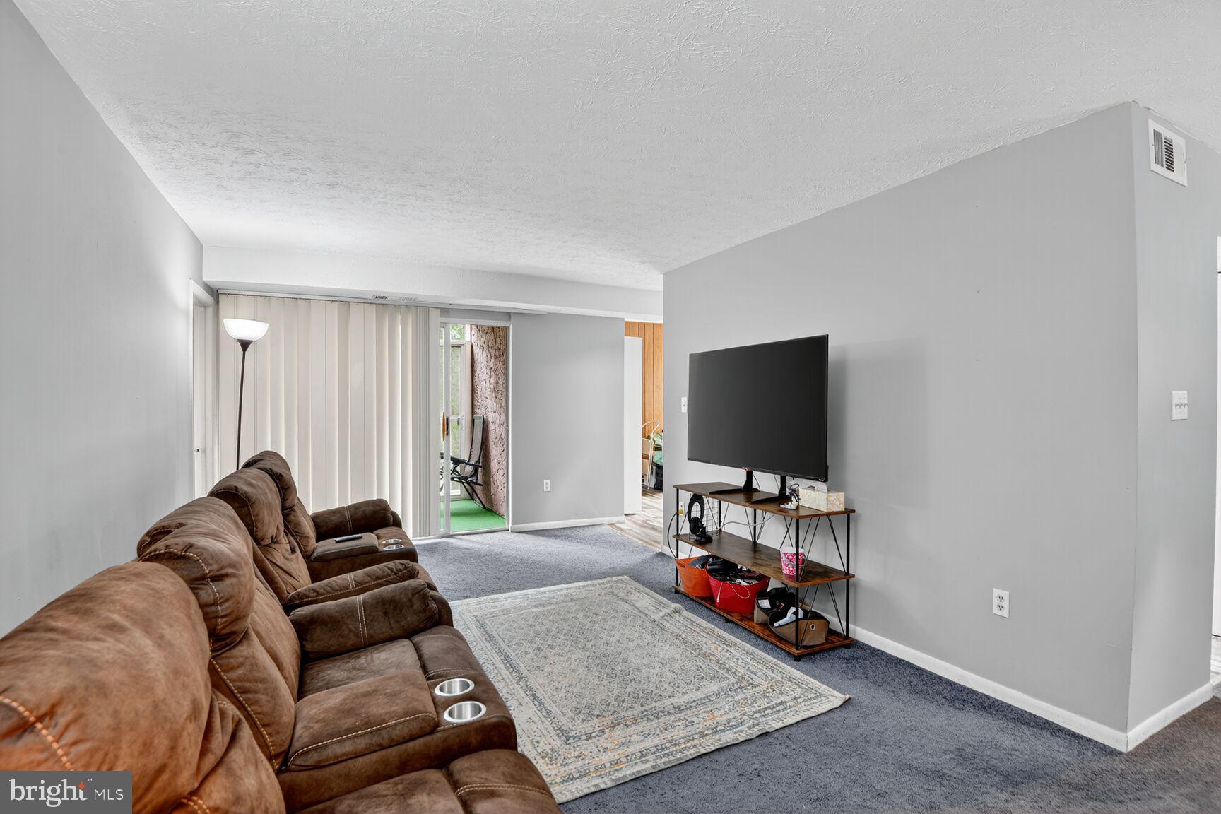 Condo fees have been reduced for this unit, and it was recently appraised at $199,900! Space, value, and convenience come together in this spacious 2-bedroom + den, 2-bath condo offering nearly 1,300 square feet of flexible living space.

This home lives beautifully beyond the traditional 2-bedroom layout. The additional guest room/den, complete with a closet, door, and window, has been used by the current owners as a third sleeping space, offering options for guests, work-from-home needs, hobbies, or additional living space. A separate den just off the kitchen provides even more flexibility and can serve as a dining nook, play area, office, or casual sitting space.

The living room is bright and generously sized, with a separate dining area and a screened-in balcony that functions beautifully as a breakfast nook or relaxing outdoor retreat. The kitchen and entry feature updated flooring, the carpet throughout is in excellent condition, and both bathrooms have been refreshed for added comfort and convenience.

All utilities are included in the condo fee, making monthly expenses easier to manage. The community also offers ample parking, with three parking tags included, plus close proximity to shopping, dining, and commuter routes.

With reduced condo fees, generous space, flexible rooms, and a recent appraisal of $199,900, this home offers a compelling combination of comfort, function, and value.