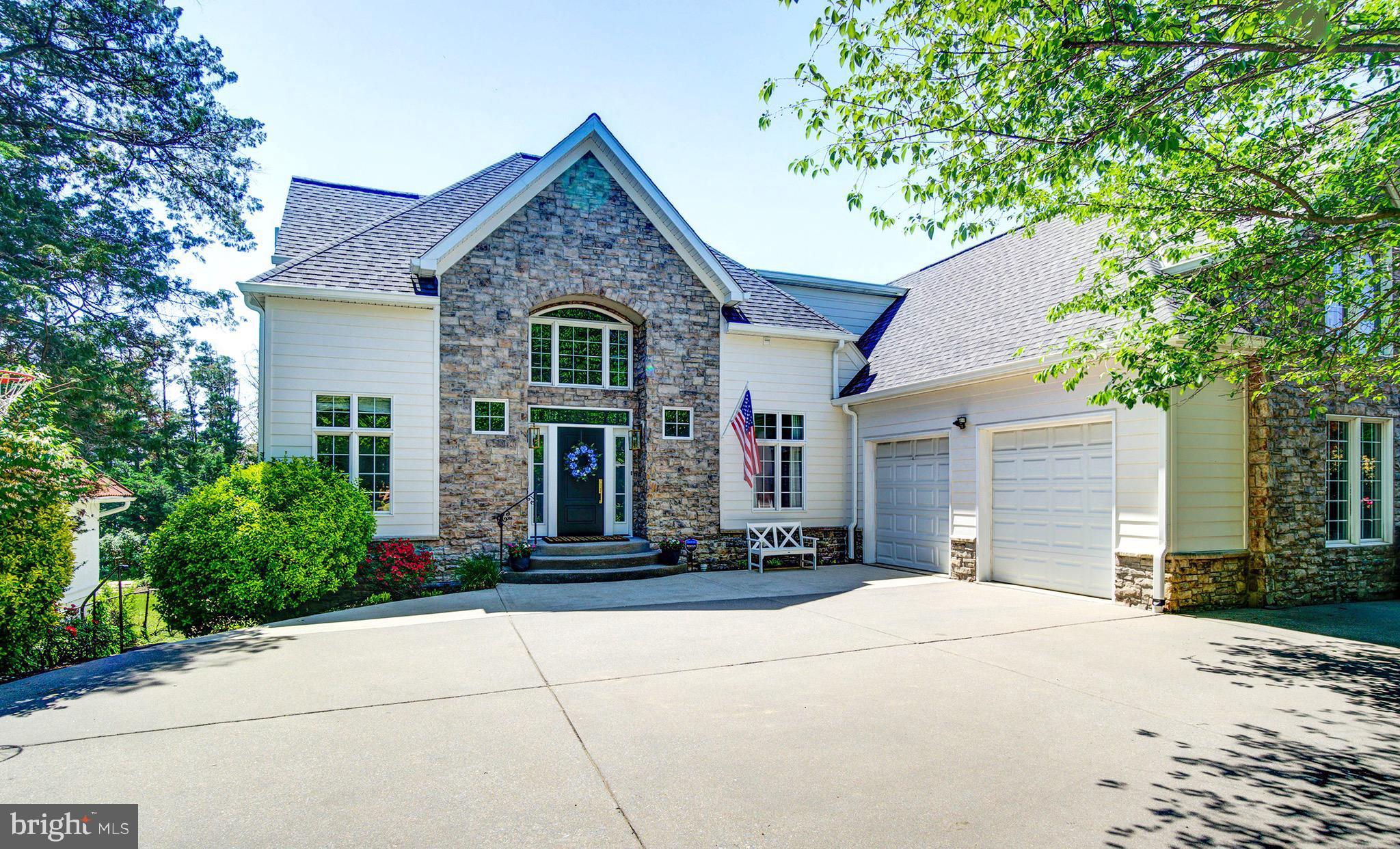 Nestled in the heart of Arlington's Leeway neighborhood, this exquisite 5 bedroom, 5.5 bath home, situated on a hard-to-find one-third acre lot, offers over 3,900 sq ft of living space. This home has been extensively renovated, and now features new white oak hardwoods and carpet, a completely remodeled kitchen with top-of-the-line appliances and custom backsplash, elegant new lighting throughout (chandeliers and LED recessed lights), and custom mudroom maple lockers and drawers. The home boasts a grand new entryway, a new roof and gutters, freshly painted interiors and exteriors, and a refurbished and rescreened two-story deck. The walk-out basement, which can be used as a separate rental unit, and the expansive backyard provide plenty of space for indoor and outdoor living.