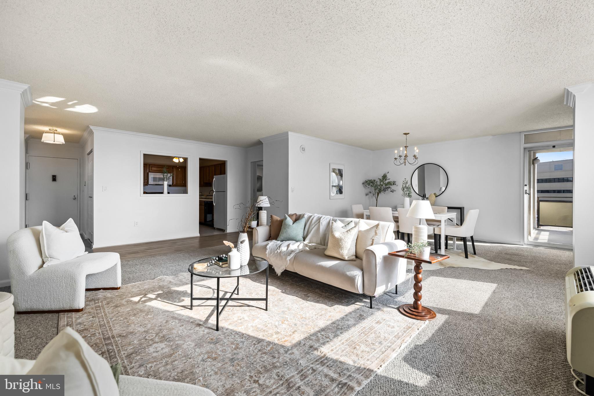**FHA Financing available thru First Home Mortgage! Ask Rachael Altemose for details.**
Location, location, location, right?  How about living 2-3 blocks from all the action that downtown Towson has to offer - the dining, night life, shops, services and activities - so close you won't need to drive! For the commutes that do require a car, this unit includes  2 highly prized garage parking spots. This newly refreshed 11th floor unit offers expansive southeasterly views of the Towson skyline (you should see it sparkle at night!) and a layout that is spacious and airy with generously proportioned living spaces throughout. Featuring an impressively sized kitchen with a huge pantry, large living and dining rooms with walls of windows giving abundant natural light and panoramic cityscape views, in-unit laundry (ahh!) and two large bedrooms (primary bedroom includes ensuite bath and walk-in closet). The building has 3 elevators, a friendly 24-hour front desk service with 24/7 security monitoring, a fabulous inground saltwater pool to indulge in on those summer scorchers and a large fitness room. *ASK Rachael Altemose about FINANCING OPTIONS!*