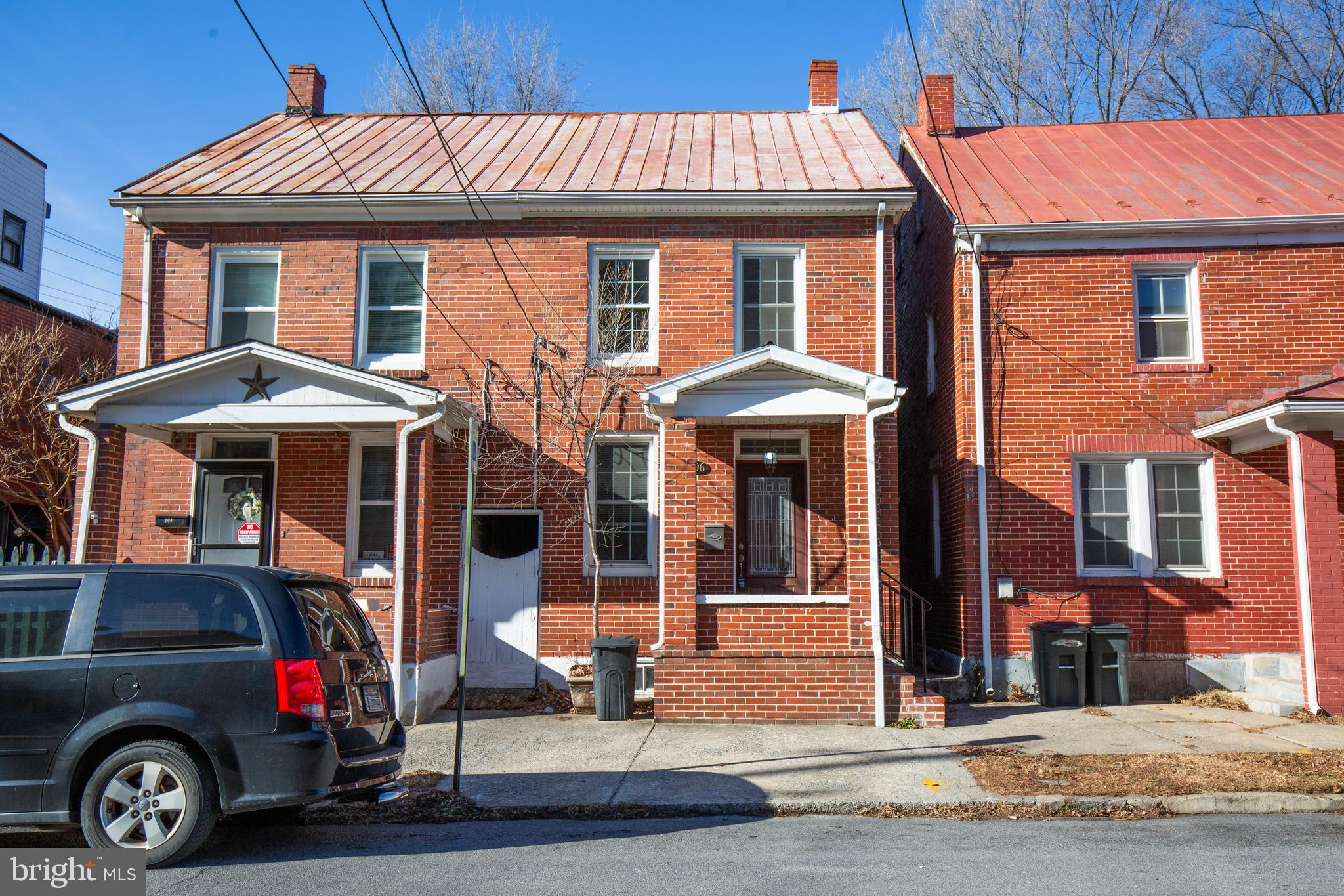 This beautifully maintained 2 level duplex in historic downtown Martinsburg, WV, offers a first level with gorgeous hardwood floors throughout the living and dining area, recently renovated kitchen with direct access to the rear patio and fenced yard, and half bath.

The second level also features hardwood floors throughout the well-sized 2 bedrooms, a large recently renovated full bath conveniently with washer and dryer, and access to the attic for additional storage.
Street parking is available.